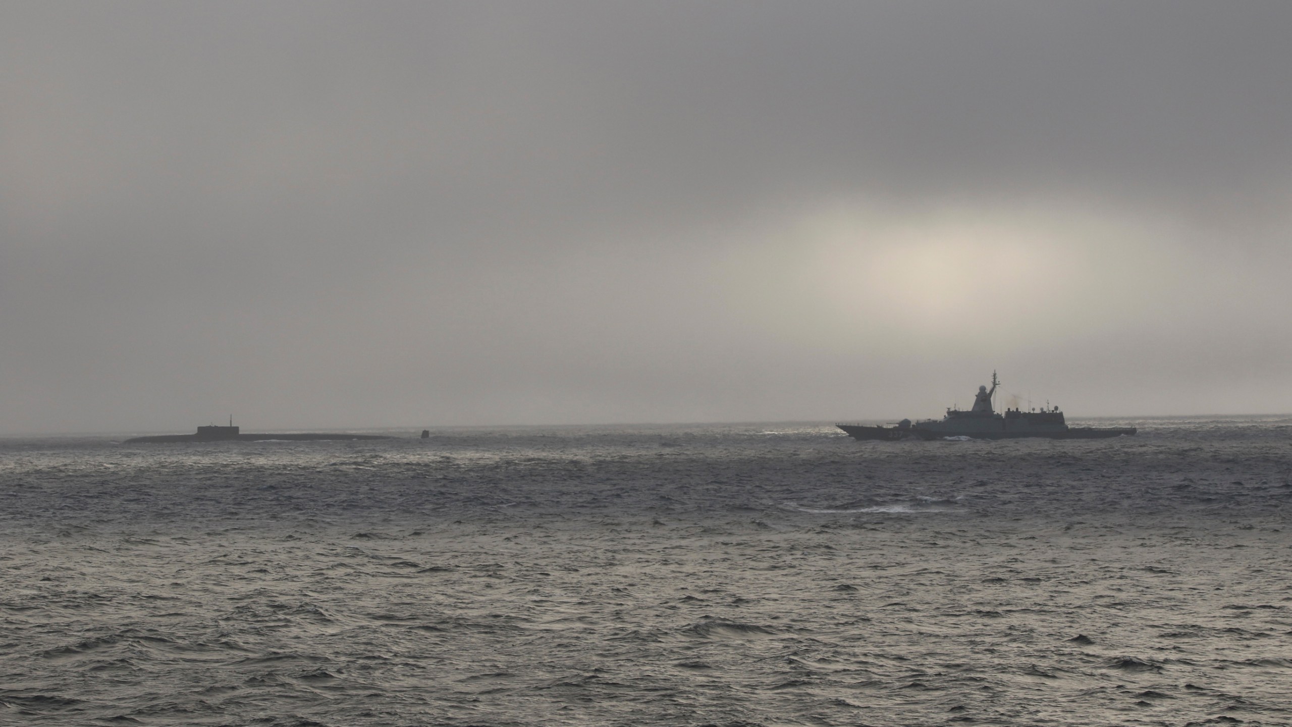 In this image released by the U.S Coast Guard, the U.S. Coast Guard Cutter Stratton, right, shadows a Russian submarine about 57 miles northwest of Point Hope, Alaska on Sept. 15, 2024. ( U.S Coast Guard via AP)