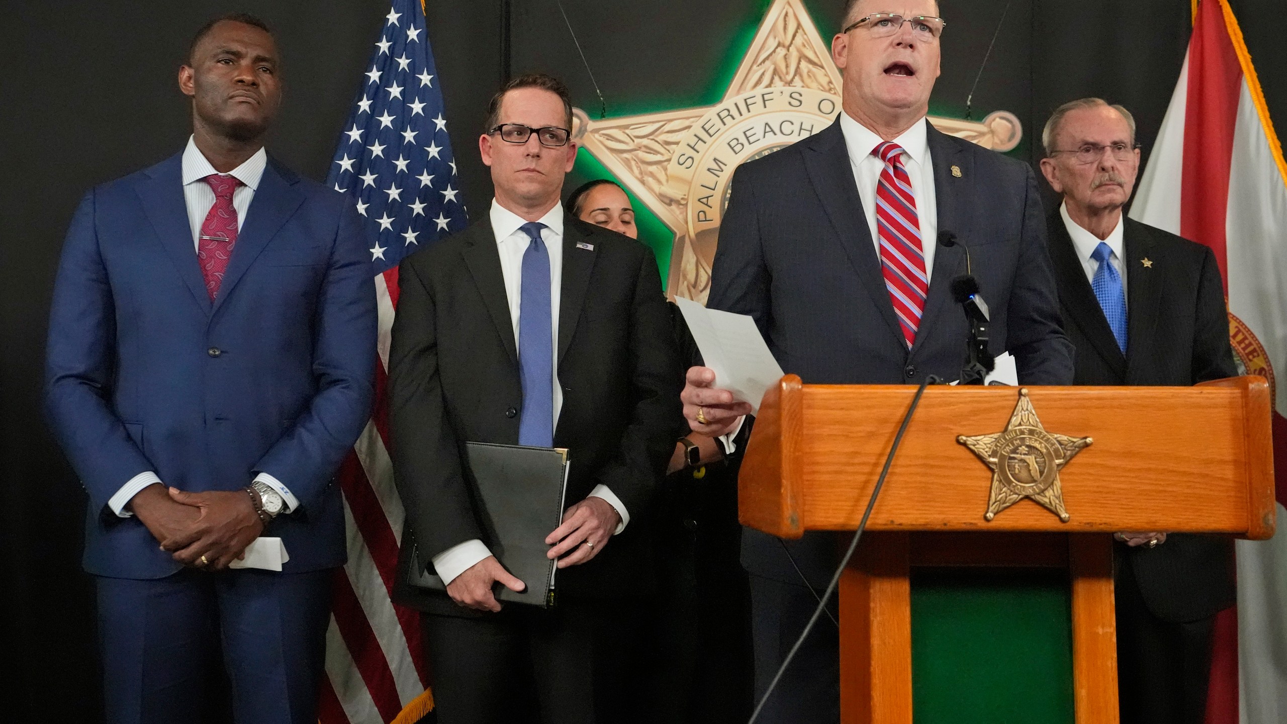 FILE - Ronald Rowe Jr., the acting director of the Secret Service, speaks during a news conference by law enforcement officials, Sept. 16, 2024, at the Palm Beach County Sheriff's Office in West Palm Beach, Fla. Listening in are, from left, U.S. Attorney Markenzy Lapointe, for the Southern District of Florida, Special Agent in Charge Jeffrey B. Veltri of the FBI Miami Field Office, and Palm Beach County Sheriff Ric Bradshaw. (AP Photo/Wilfredo Lee, File)