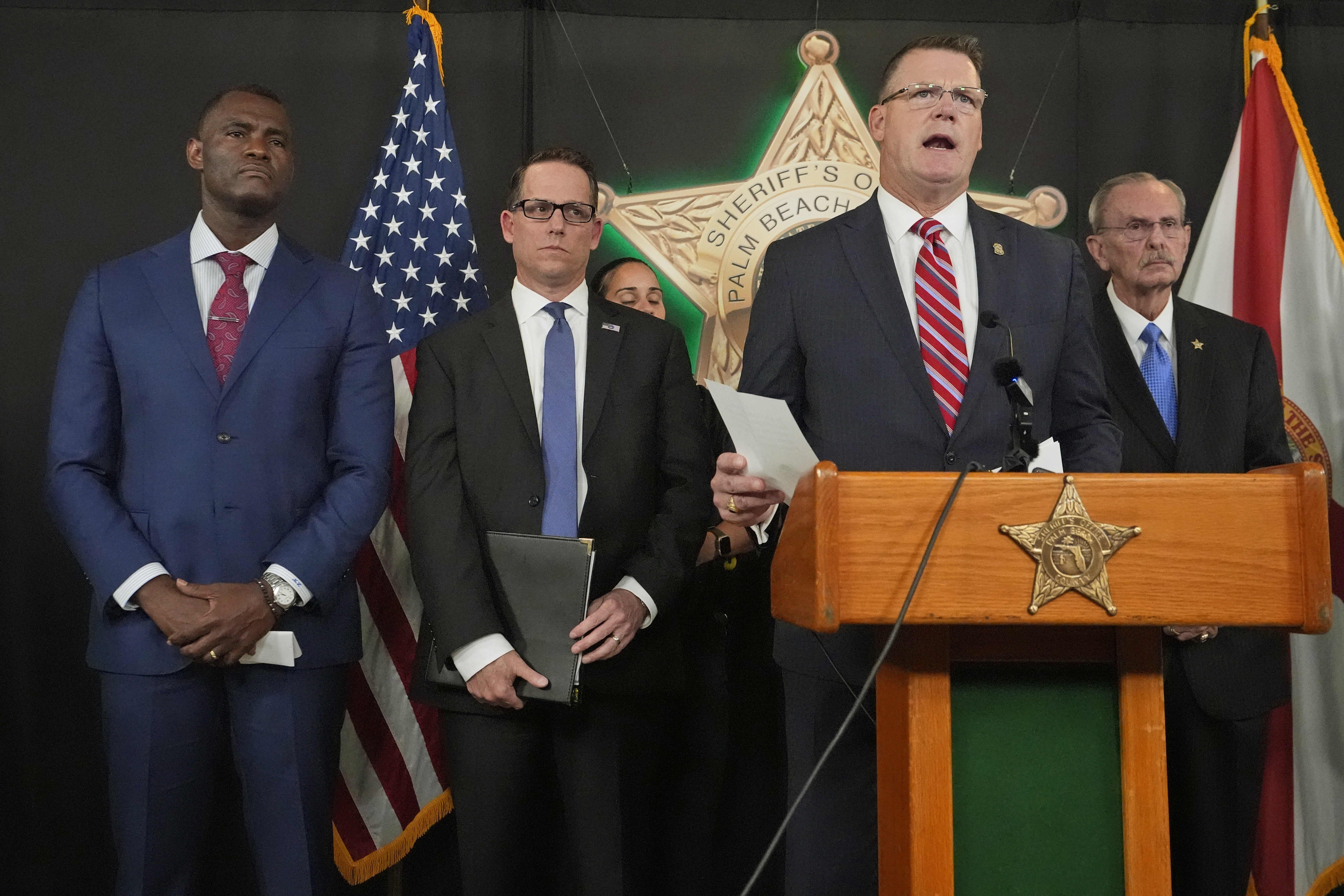 FILE - Ronald Rowe Jr., the acting director of the Secret Service, speaks during a news conference by law enforcement officials, Sept. 16, 2024, at the Palm Beach County Sheriff's Office in West Palm Beach, Fla. Listening in are, from left, U.S. Attorney Markenzy Lapointe, for the Southern District of Florida, Special Agent in Charge Jeffrey B. Veltri of the FBI Miami Field Office, and Palm Beach County Sheriff Ric Bradshaw. (AP Photo/Wilfredo Lee, File)