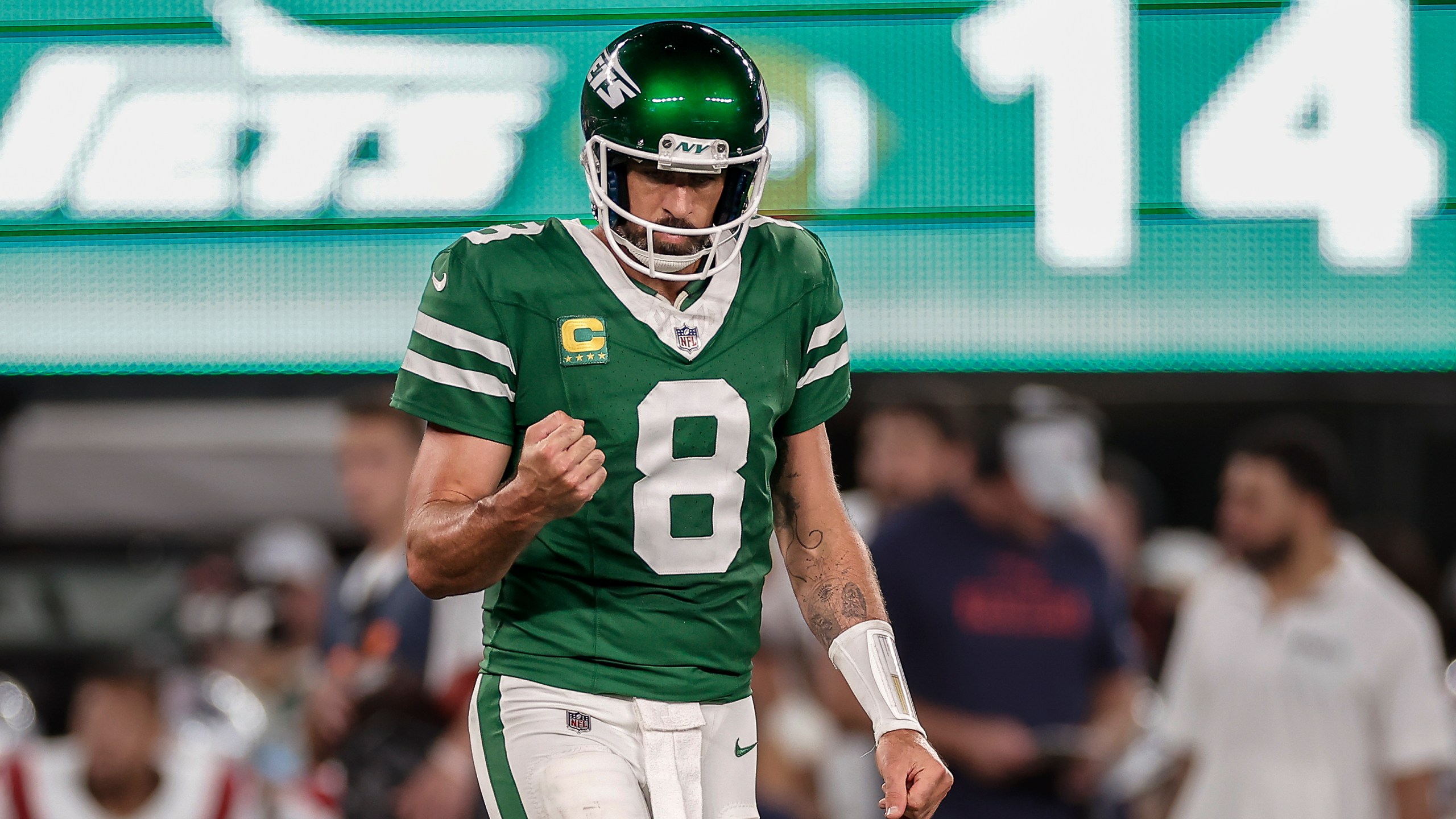 New York Jets quarterback Aaron Rodgers (8) reacts during the third quarter of an NFL football game against the New England Patriots, Thursday, Sept. 19, 2024, in East Rutherford, N.J. (AP Photo/Adam Hunger)