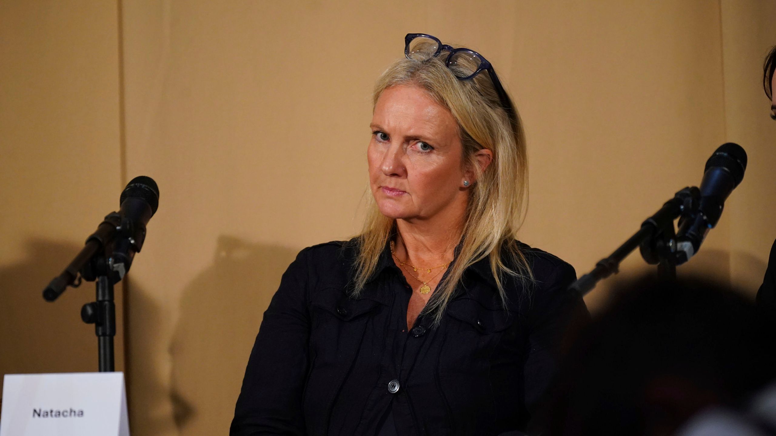 One of Mr Al Fayed's accusers, Natacha (no surname given), who featured in 'Al-Fayed: Predator at Harrods', looks on during a press conference to discuss their involvement in the investigation and the legal claim against Harrods for failing to provide a safe system of work for their employees, at Kent House in Knightsbridge, London, Friday Sept. 20, 2024. Multiple ex-Harrods employees have accused Mohamed Al Fayed, the Egyptian billionaire who owned the luxury department store for more than 25 years, of rape and sexual assault. (Yui Mok/PA via AP)