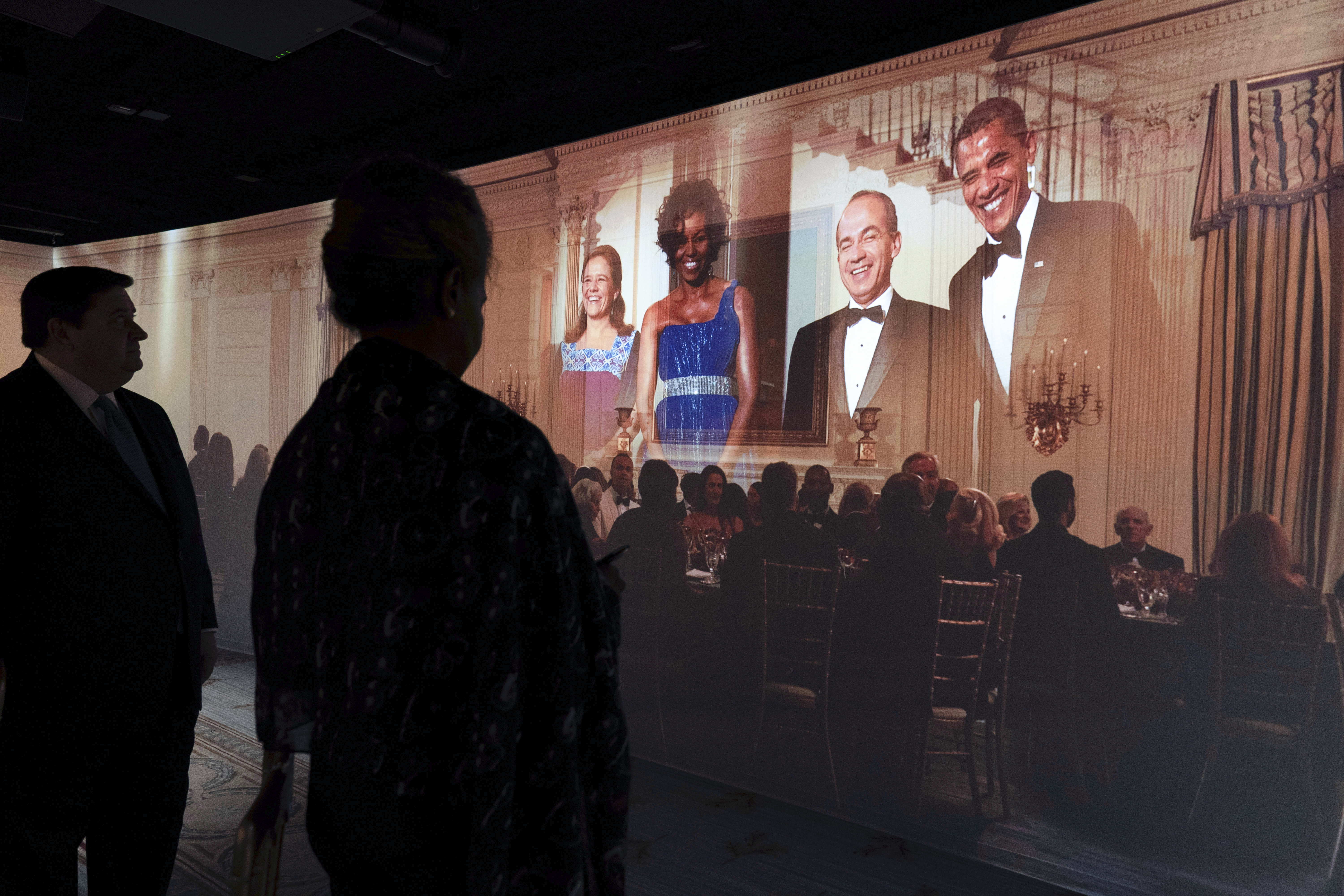 A 3D interactive room with dinner tables, music and videos of State Dinners at the White House, shown at The People's House exhibit, Monday, Sept. 16, 2024 in Washington. (AP Photo/Jose Luis Magana)