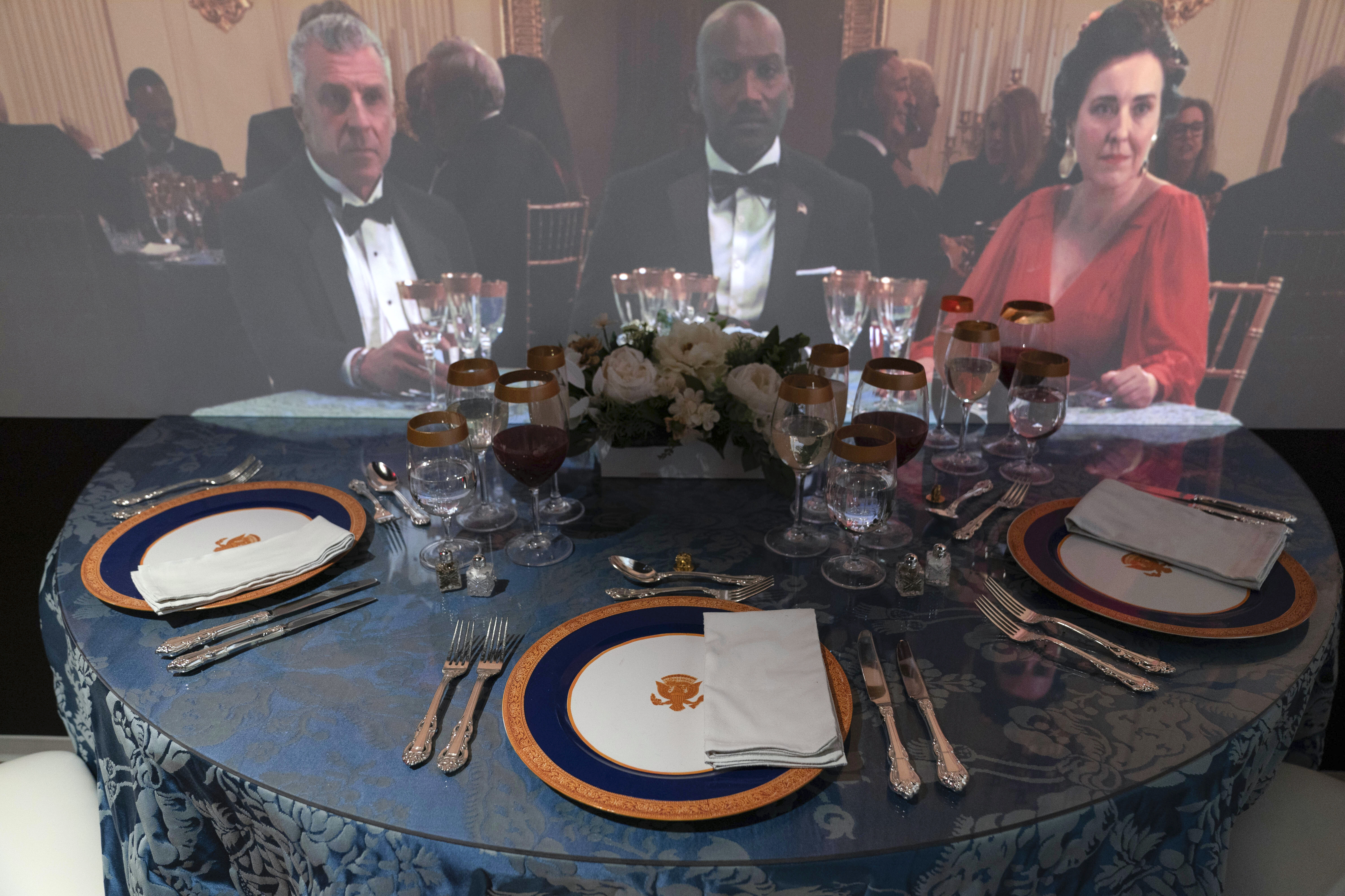 A 3D interactive room with dinner tables, music and videos of State Dinners at the White House, shown at The People's House exhibit, Monday, Sept. 16, 2024 in Washington. (AP Photo/Jose Luis Magana)