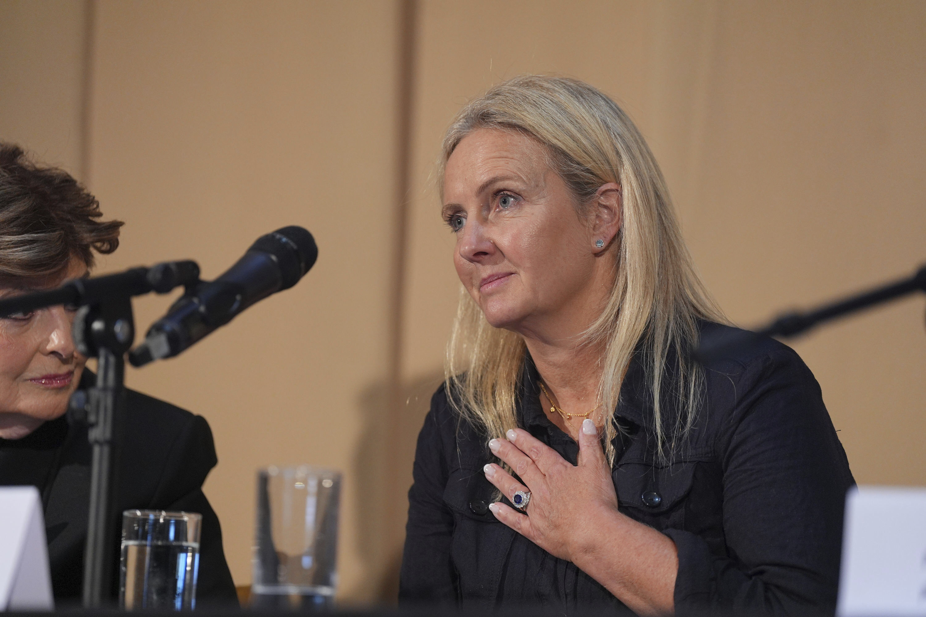 One of Mr Al Fayed's accusers, Natacha (no surname given), who featured in 'Al-Fayed: Predator at Harrods' attends a press conference to discuss their involvement in the investigation and the legal claim against Harrods for failing to provide a safe system of work for their employees, at Kent House in Knightsbridge, London, Friday Sept. 20, 2024. (Yui Mok/PA via AP)