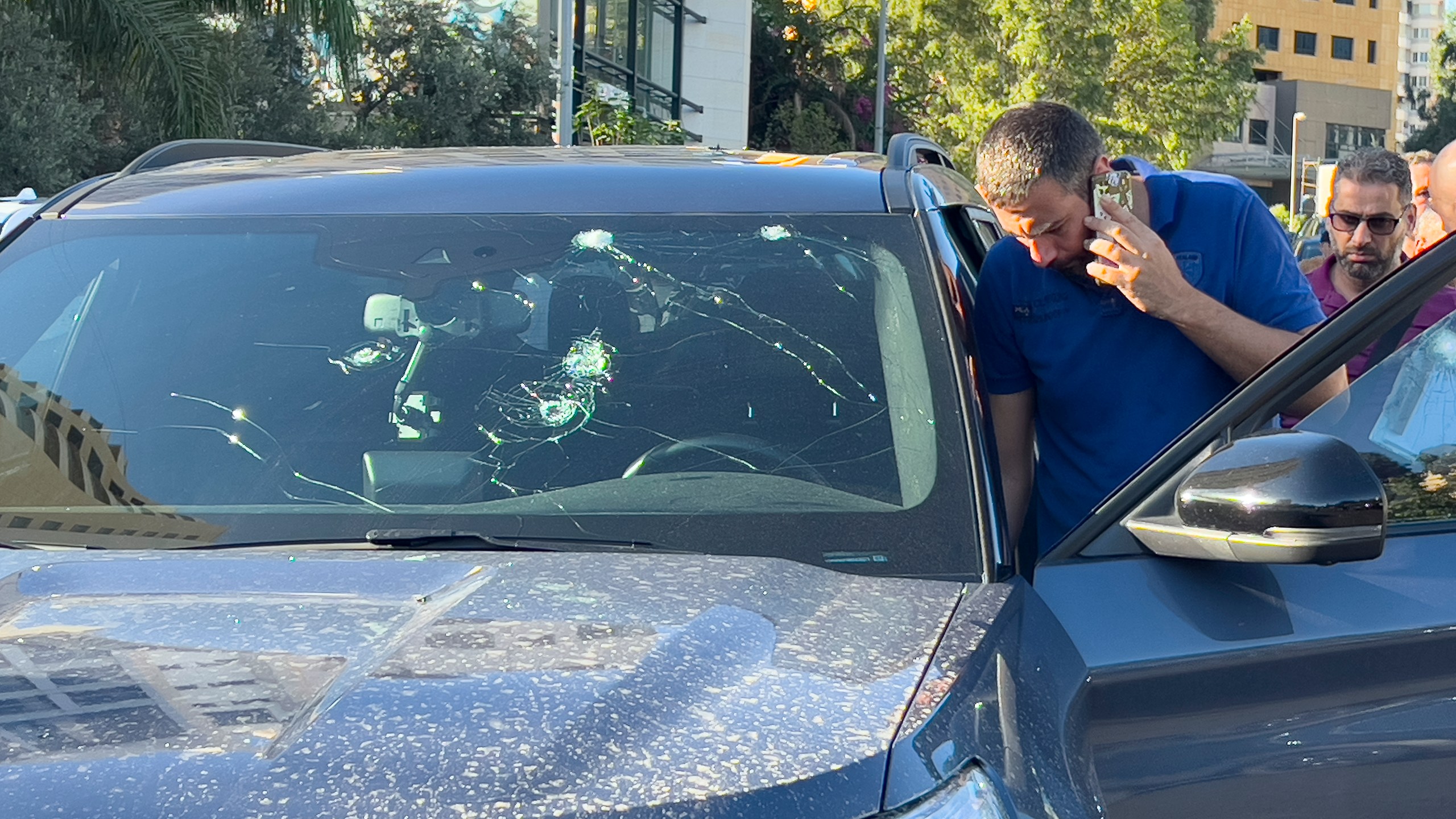 FILE - Police officers inspect a car inside of which a hand-held pager exploded, Beirut, on Sept. 17, 2024. (AP Photo/Hussein Malla, File)