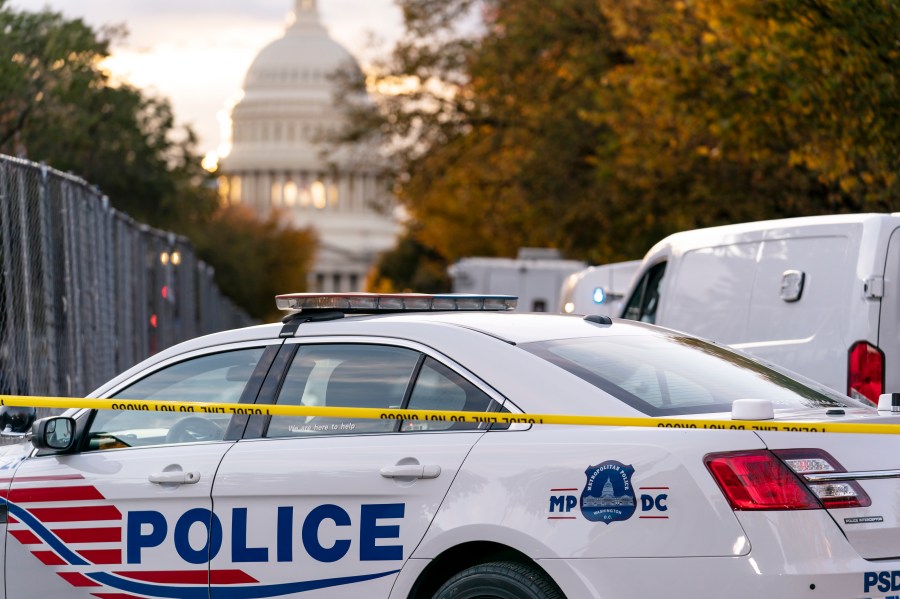 FILE - A Washington Metropolitan Police vehicle is seen near the Capitol, Oct. 19, 2022, in Washington. Police on Friday arrested a 15-year old boy on charges related to threats on social media that prompted an increased police presence at multiple schools in the nation's capital. The Instagram post showing a firearm and a list of D.C. schools prompted police to station officers at several different schools on Thursday. (AP Photo/J. Scott Applewhite, File)