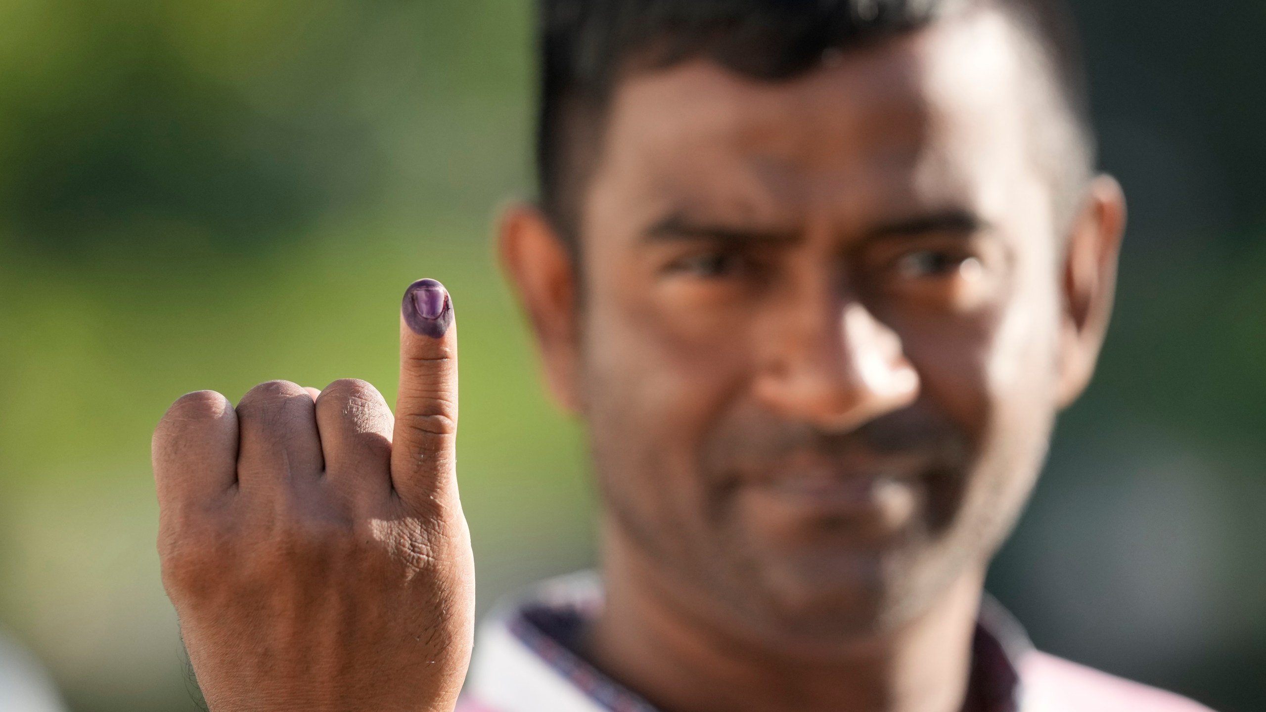 A person shows indelible mark on his finger after casting his vote in Colombo, Sri Lanka, Saturday, Sept. 21, 2024. (AP Photo/Eranga Jayawardane)