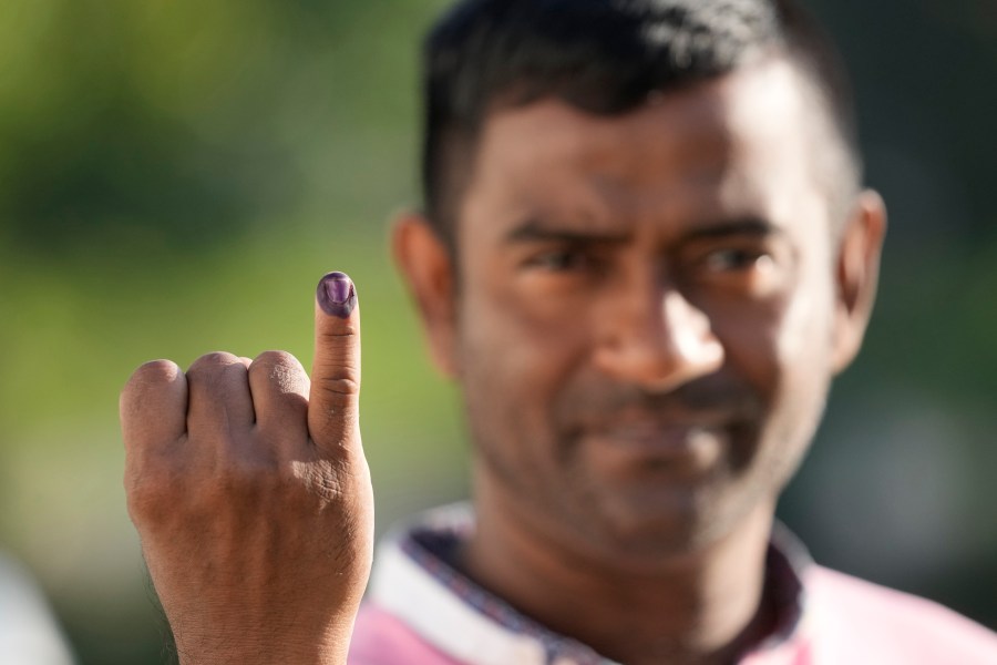 A person shows indelible mark on his finger after casting his vote in Colombo, Sri Lanka, Saturday, Sept. 21, 2024. (AP Photo/Eranga Jayawardane)