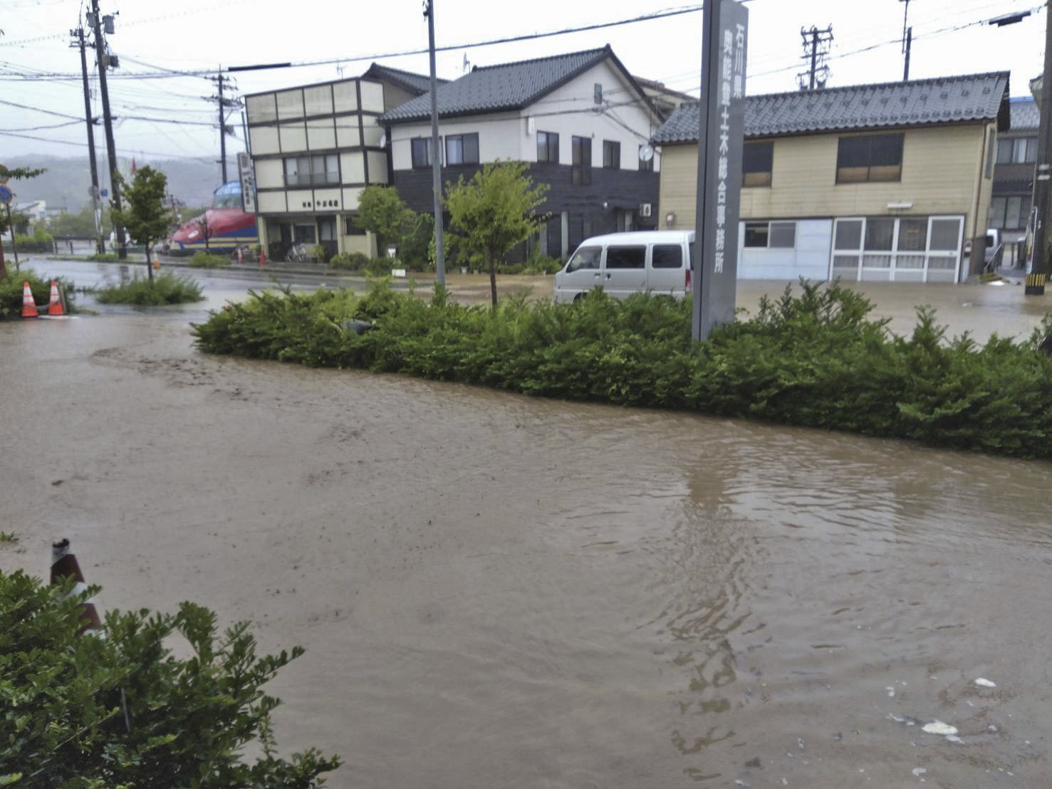 A road is flooded after heavy rain in Wajima, Ishikawa prefecture, Saturday, Sept. 21, 2024. (Kyodo News via AP)