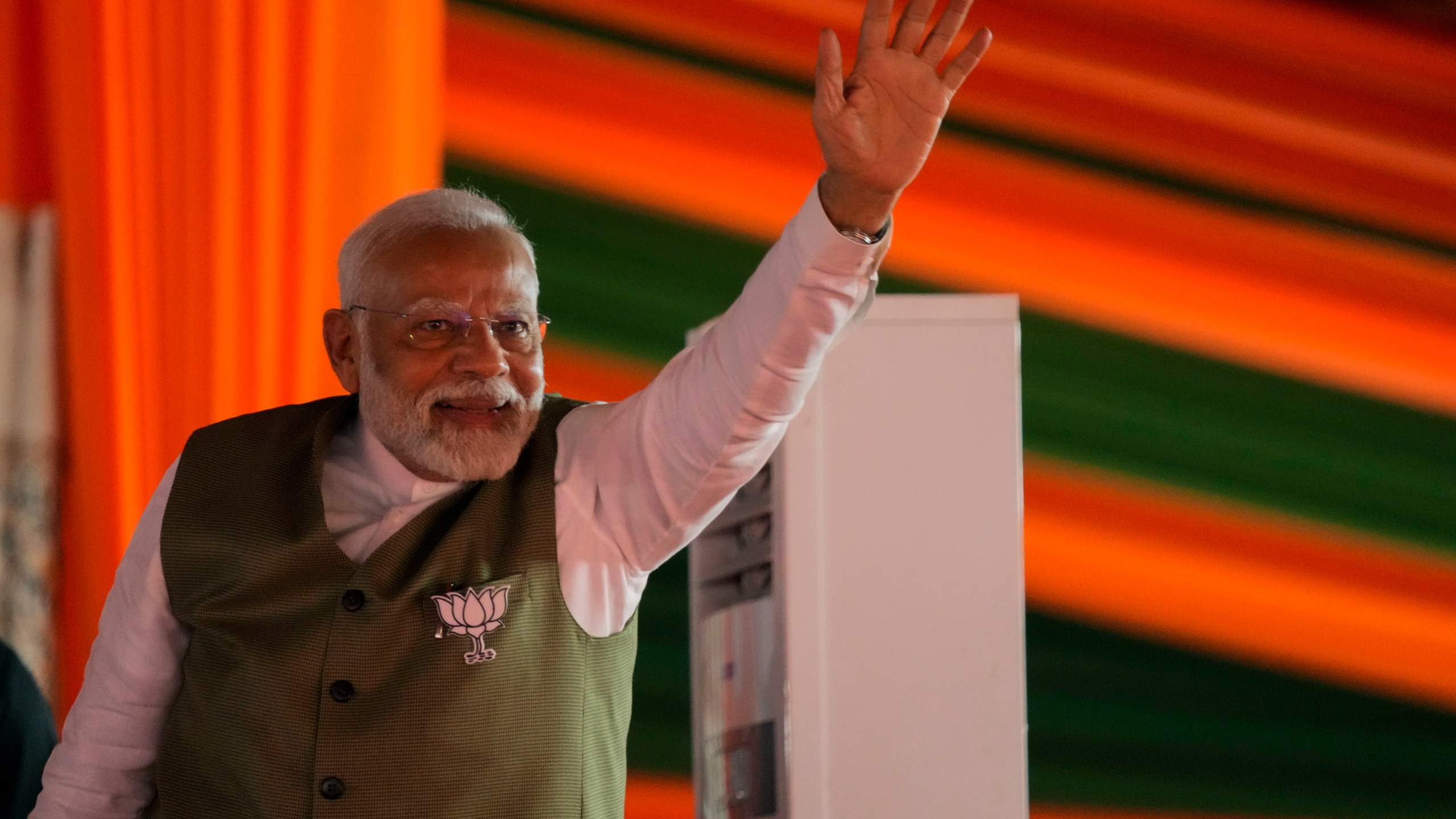 Indian Prime Minister Narendra Modi waves towards the crowd as he arrives to address the election rally in Srinagar, Indian controlled Kashmir, Thursday, Sept. 19, 2024. (AP Photo/Mukhtar Khan)