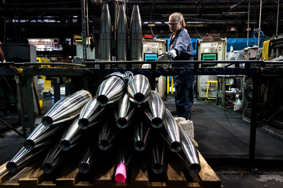 FILE -A steel worker moves a 155 mm M795 artillery projectile during the manufacturing process at the Scranton Army Ammunition Plant in Scranton, Pa., Thursday, April 13, 2023. (AP Photo/Matt Rourke, File)