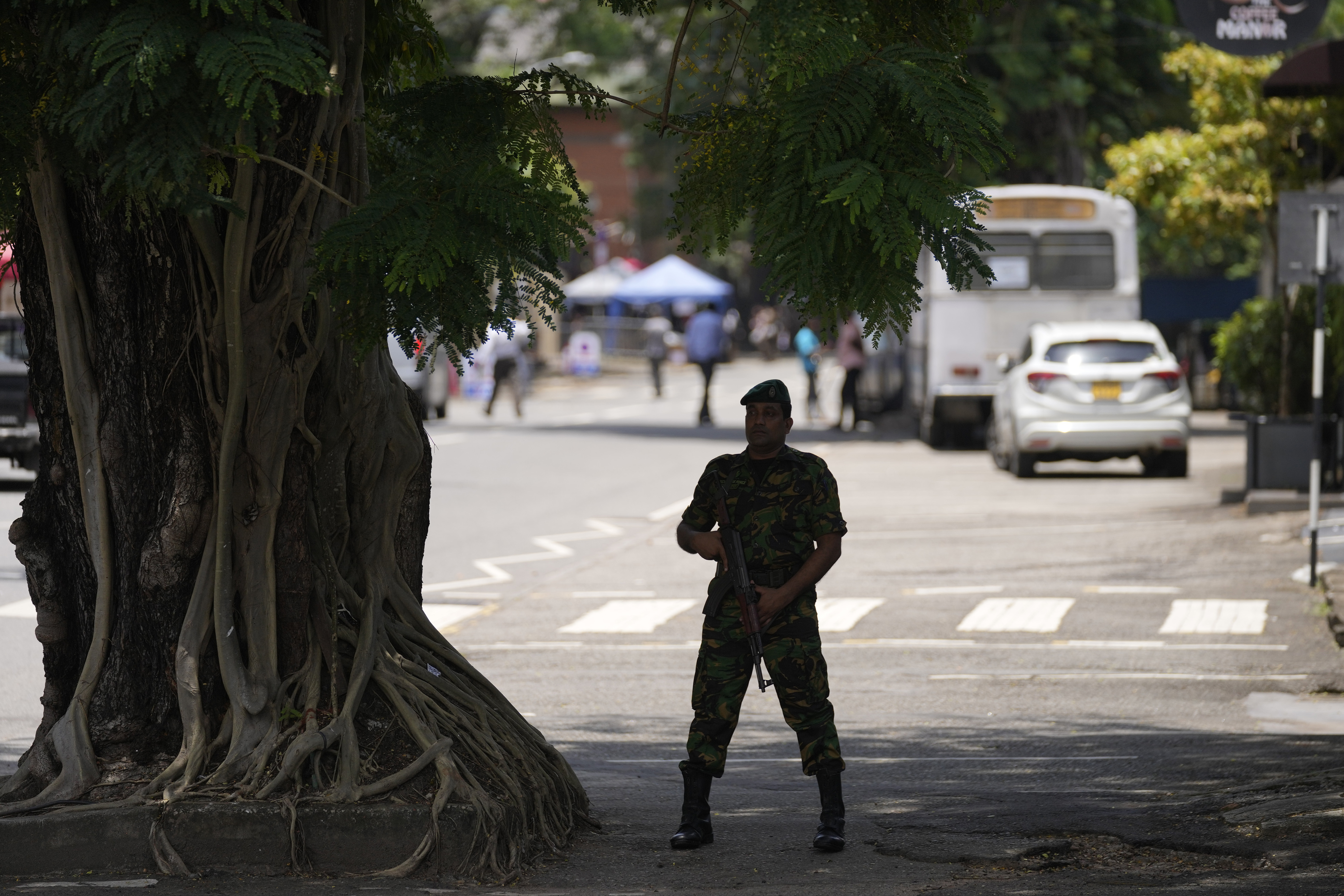 A police officer stands guard outside a polling material distribution center ahead of the presidential election, in Colombo, Sri Lanka, Friday, Sept. 20, 2024. (AP Photo/Eranga Jayawardena)