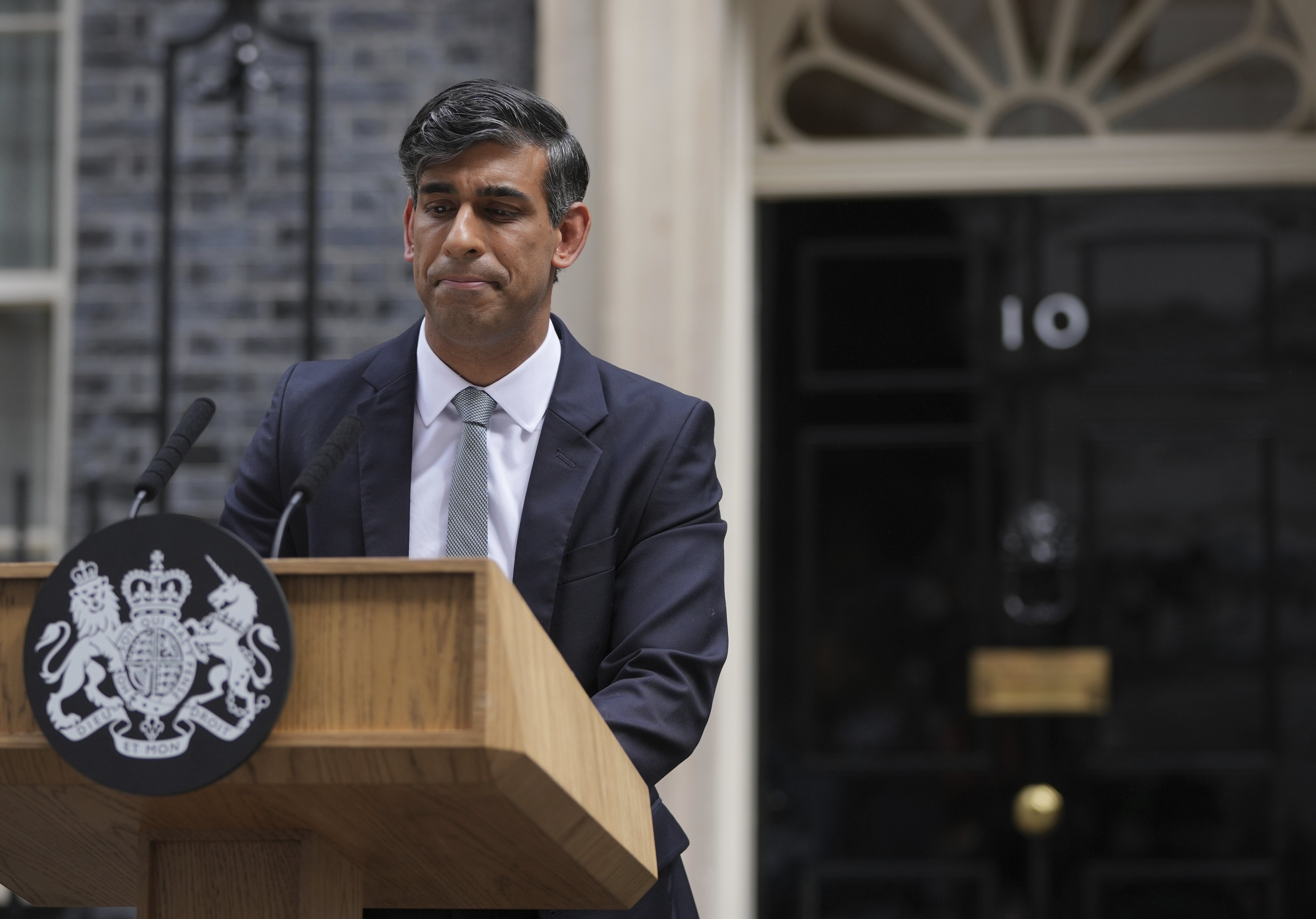 FILE - Britain's outgoing Conservative Party Prime Minister Rishi Sunak looks down as he makes a short speech outside 10 Downing Street before going to see King Charles III to tender his resignation in London, on July 5, 2024. (AP Photo/Kin Cheung, File)