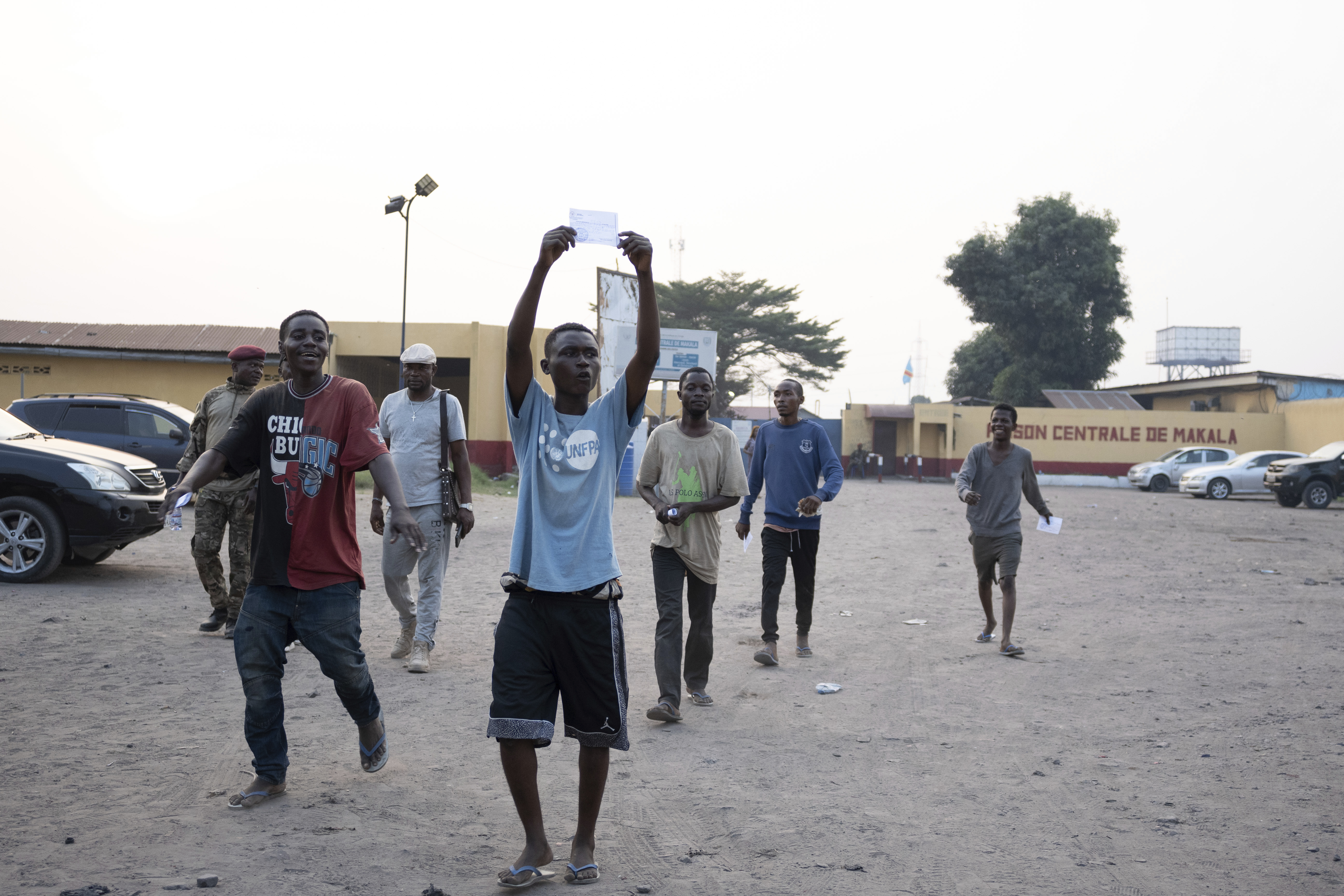 Some of the 600 prisoners released from Democratic Republic of the Congo's capital Kinshasa's Makala Central Prison react Saturday, Sept. 21, 2024. (AP Photo/Samy Ntumba Shambuyi)