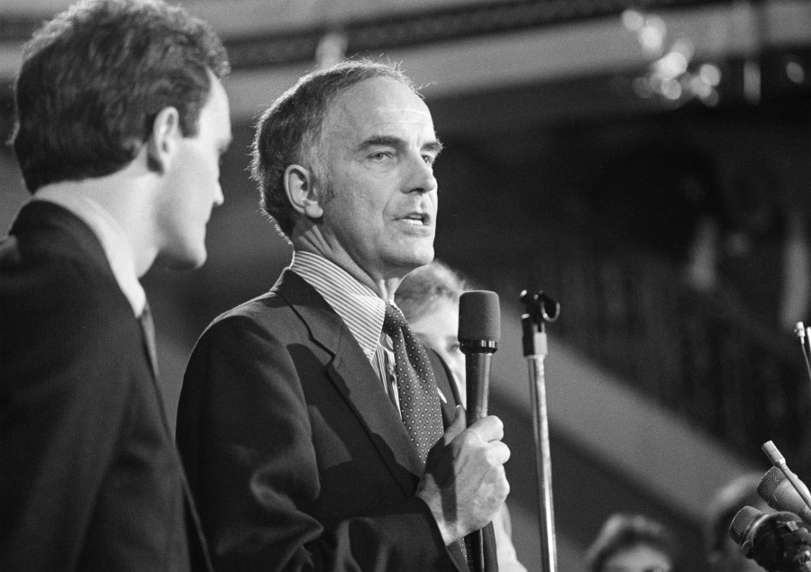 Sen. Dan Evans (R-Wash.) stands with his son Dan Jr., after he won the primary election for the senate seat for Washington State, Oct. 12, 1983. (AP Photo/Barry Sweet, File)