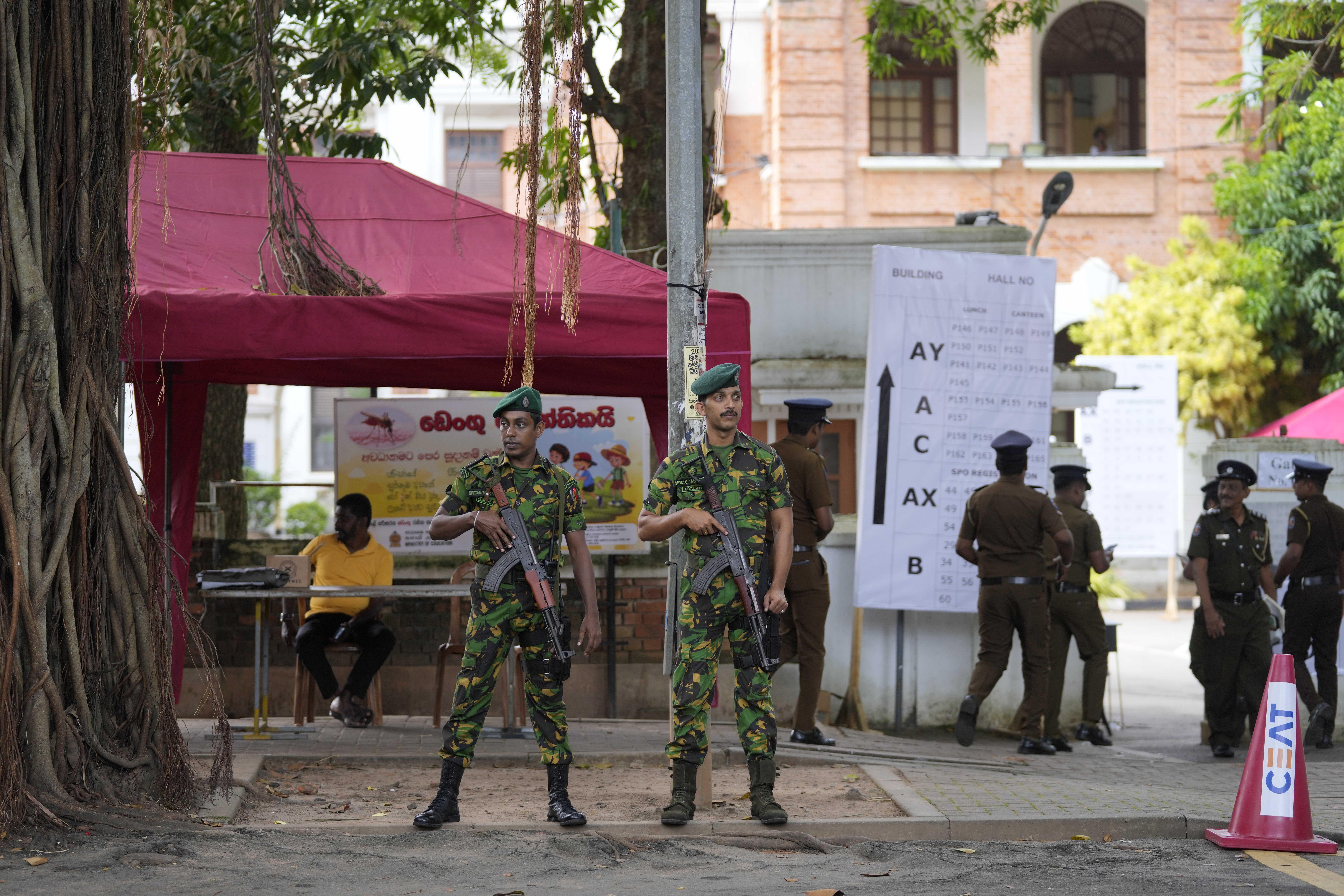 Police commandos stand guard outside a ballot counting center in Colombo, Sri Lanka, Sunday Sept. 22, 2024. (AP Photo/Eranga Jayawardane)