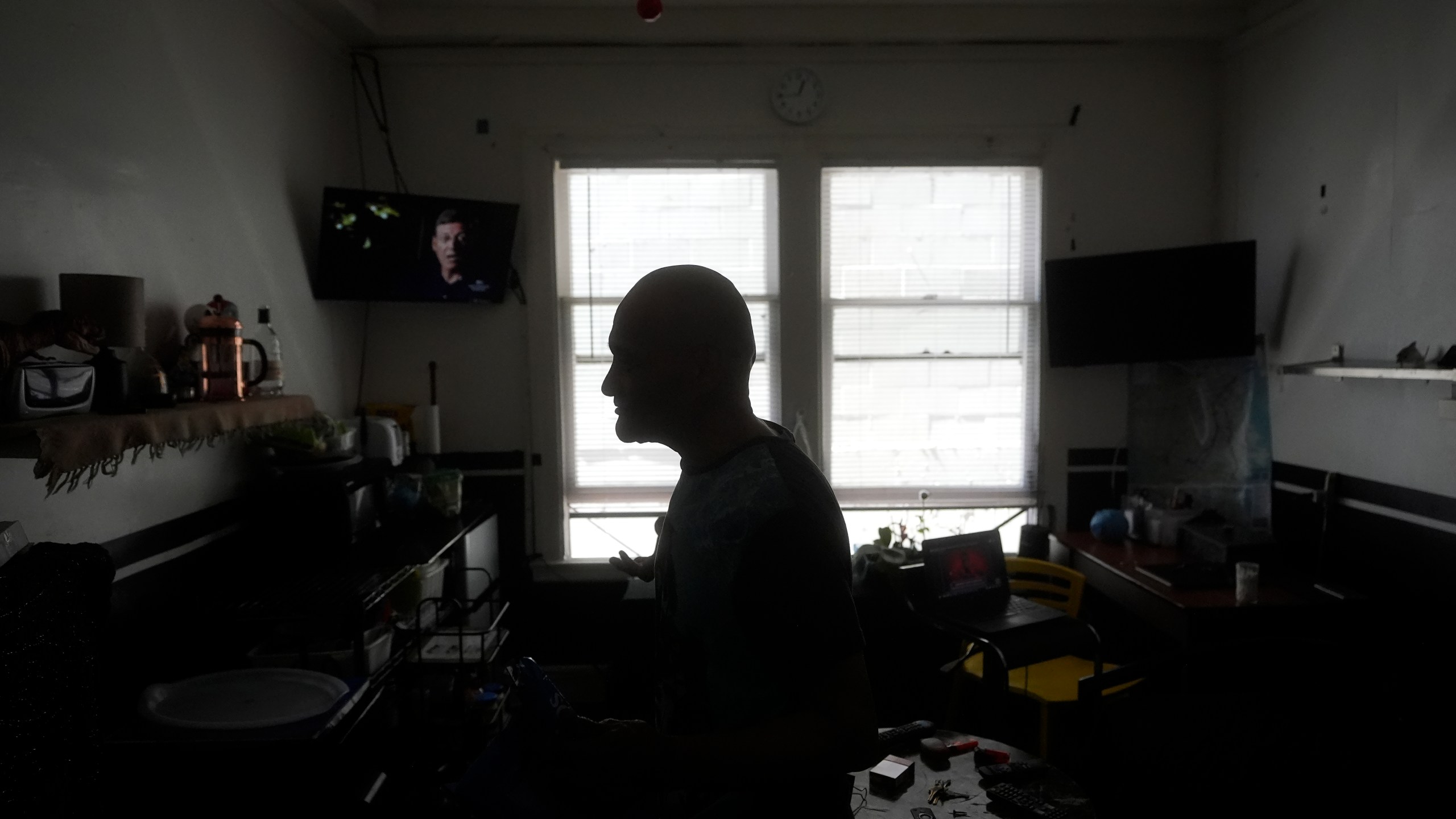 David Labogin is interviewed in his Five Keys transitional housing room in San Francisco, Monday, Aug. 26, 2024. (AP Photo/Jeff Chiu)