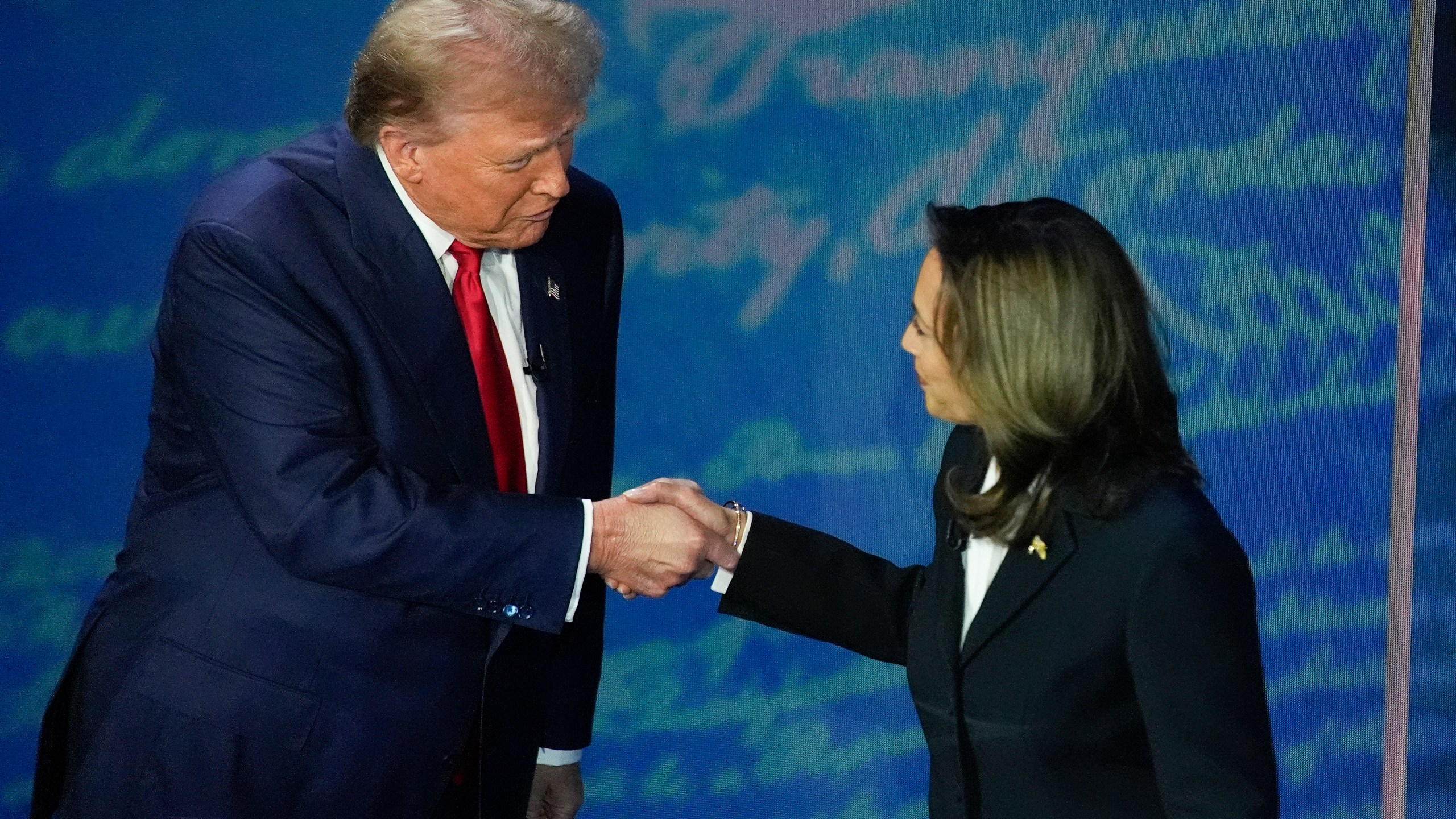 FILE - Republican presidential nominee former President Donald Trump and Democratic presidential nominee Vice President Kamala Harris shake hands before the start of an ABC News presidential debate at the National Constitution Center, Sept. 10, 2024, in Philadelphia. (AP Photo/Alex Brandon, file)