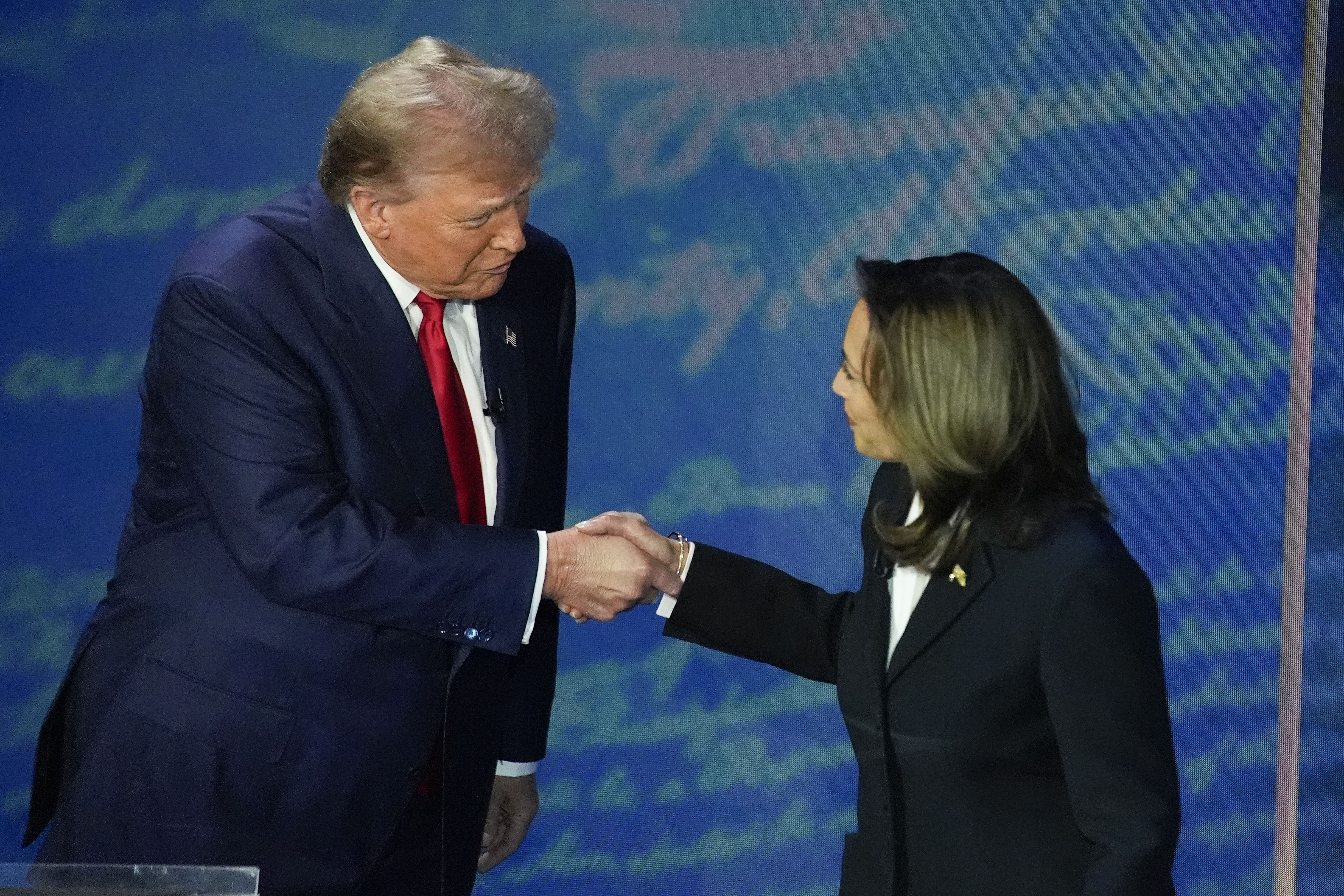 FILE - Republican presidential nominee former President Donald Trump and Democratic presidential nominee Vice President Kamala Harris shake hands before the start of an ABC News presidential debate at the National Constitution Center, Sept. 10, 2024, in Philadelphia. (AP Photo/Alex Brandon, file)