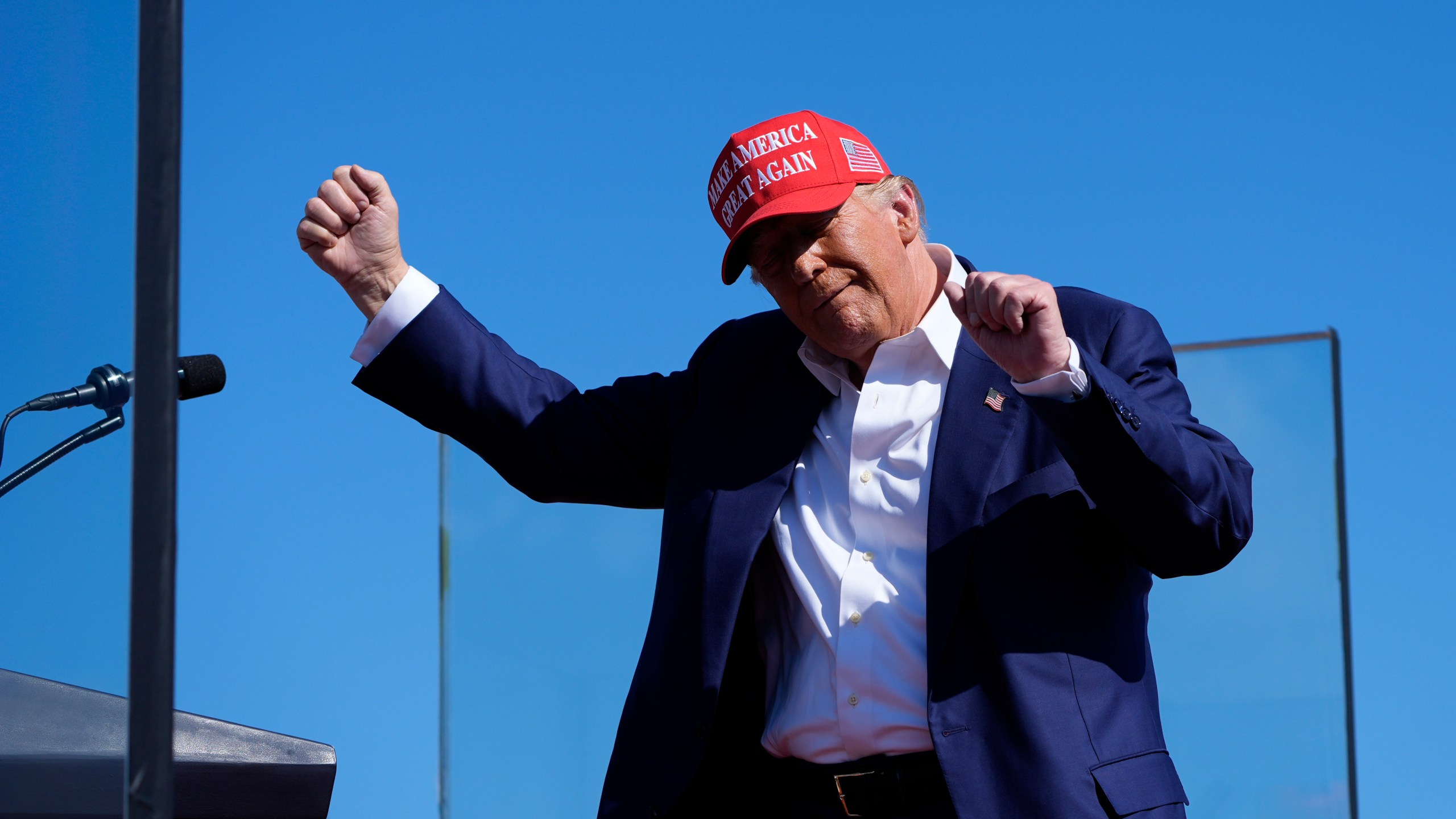 Republican presidential nominee former President Donald Trump dances after speaking at a campaign rally at Wilmington International Airport, Saturday, Sept. 21, 2024, in Wilmington, N.C. (AP Photo/Alex Brandon)