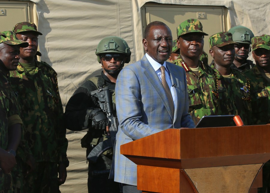 Kenya's President William Ruto speaks to Kenyan police officers, part of a UN-backed multinational force, during a visit to their base in Port-au-Prince, Haiti, Saturday, Sept. 21, 2024. (AP Photo/Odelyn Joseph)