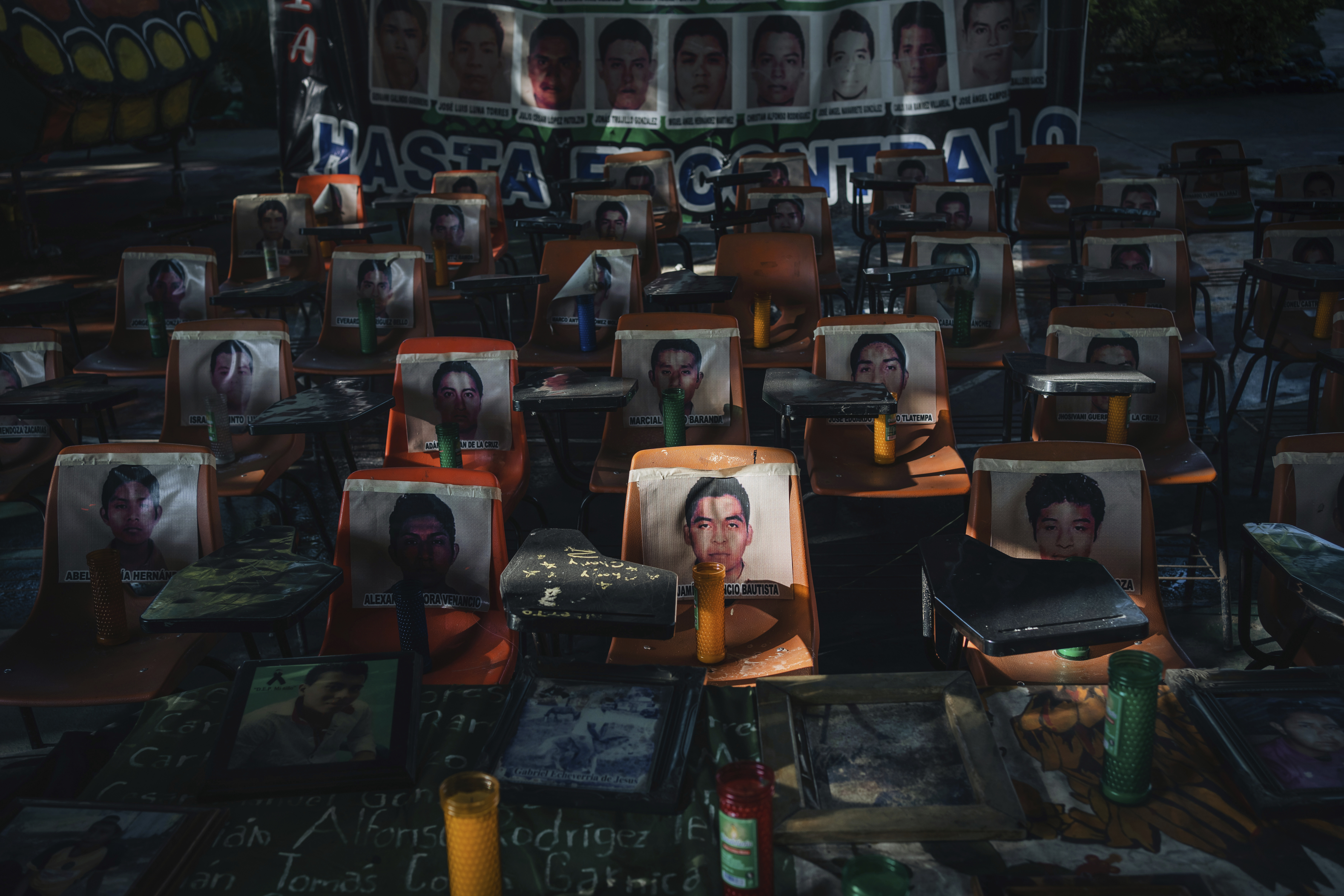 Photos of 43 students who have been missing for 10 years cover the stairs at their former Raúl Isidro Burgos Rural Normal School in Ayotzinapa, Guerrero state, Mexico, Saturday, Aug. 24, 2024. (AP Photo/Felix Marquez)