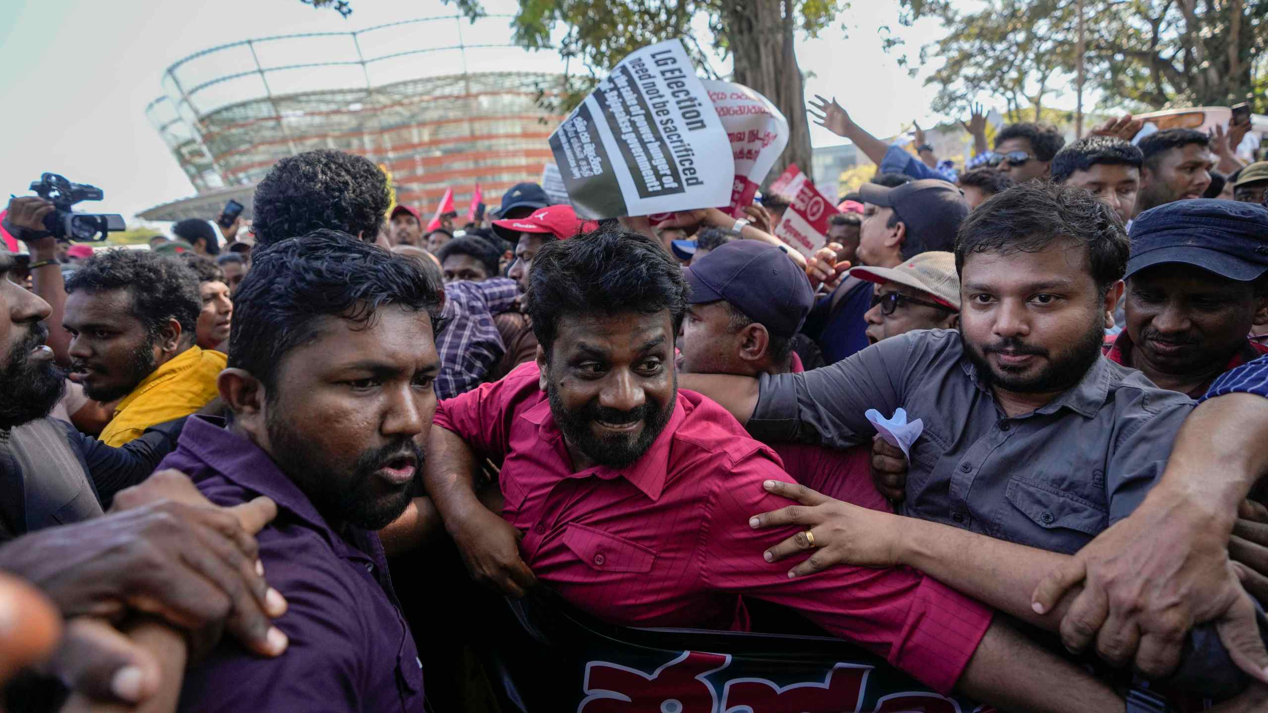 FILE -Anura Kumara Dissanayake, center, leader of opposition political party National People's Power attends a protest rally in Colombo, Sri Lanka, Feb. 26, 2023. (AP Photo/Eranga Jayawardena, File)