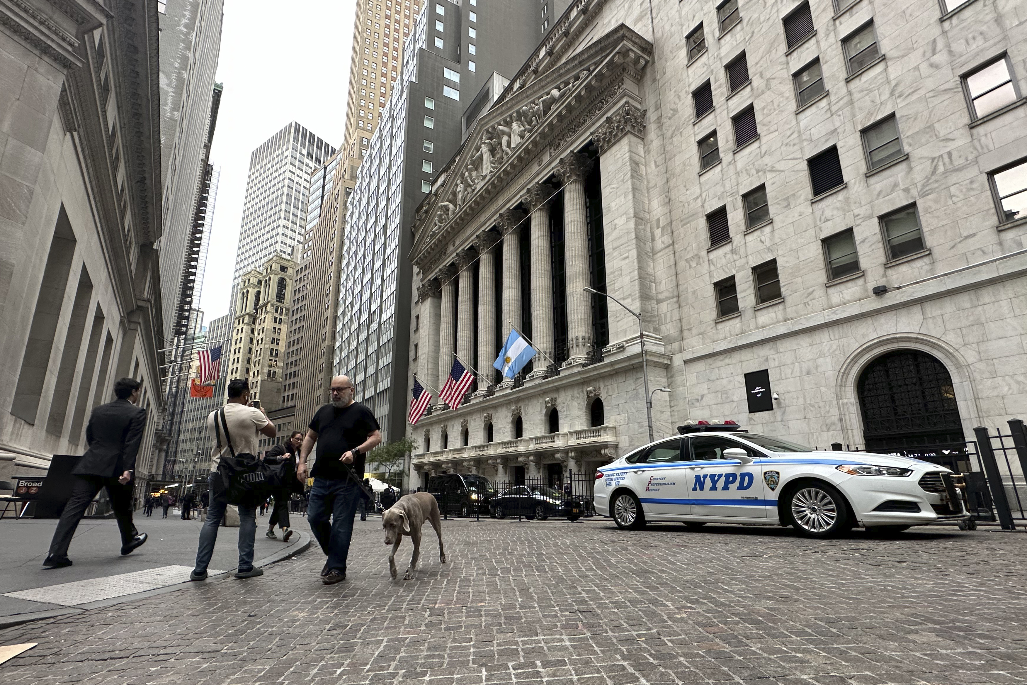 The flag of Argentina flies on the front of the New York Stock Exchange where Argentine President Javier Milei will ring the opening bell on Monday, Sept. 23, 2024, in New York. (AP Photo/Peter Morgan)