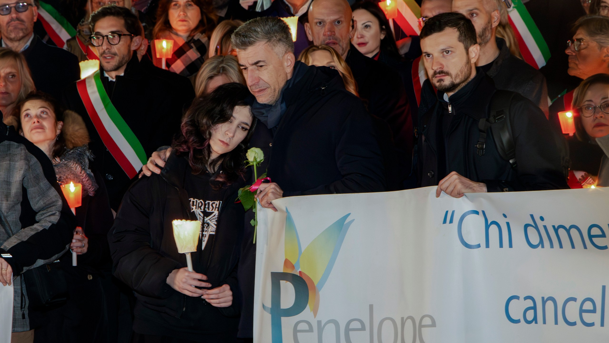 FILE - Gino Cecchettin, hugging his daughter Elena, attends a torchlit procession in Vigonovo, near Venice, northern Italy, Sunday, Nov. 19, 2023, after the police found the body of his other daughter Giulia. (Lucrezia Granzetti/LaPresse via AP)