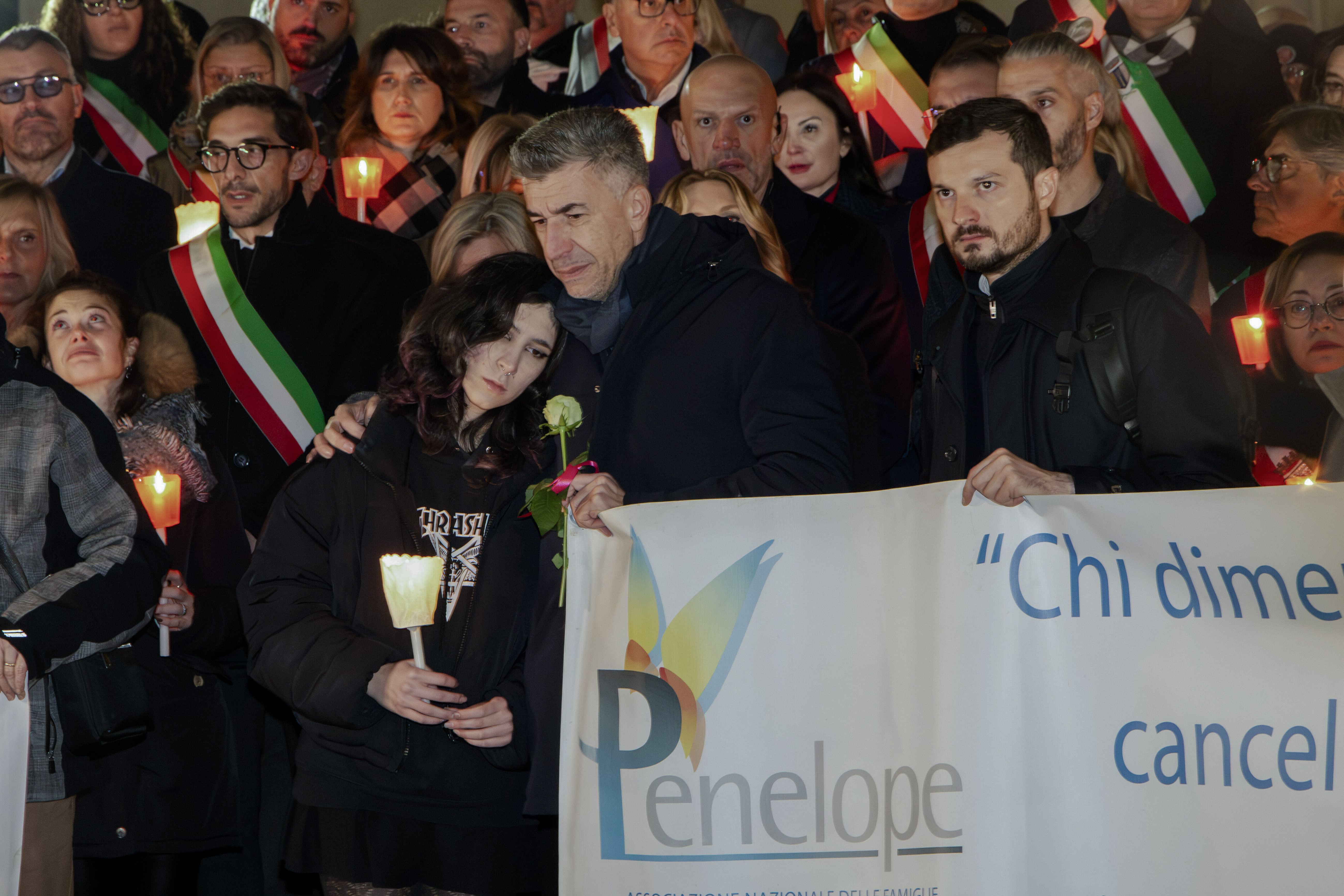 FILE - Gino Cecchettin, hugging his daughter Elena, attends a torchlit procession in Vigonovo, near Venice, northern Italy, Sunday, Nov. 19, 2023, after the police found the body of his other daughter Giulia. (Lucrezia Granzetti/LaPresse via AP)