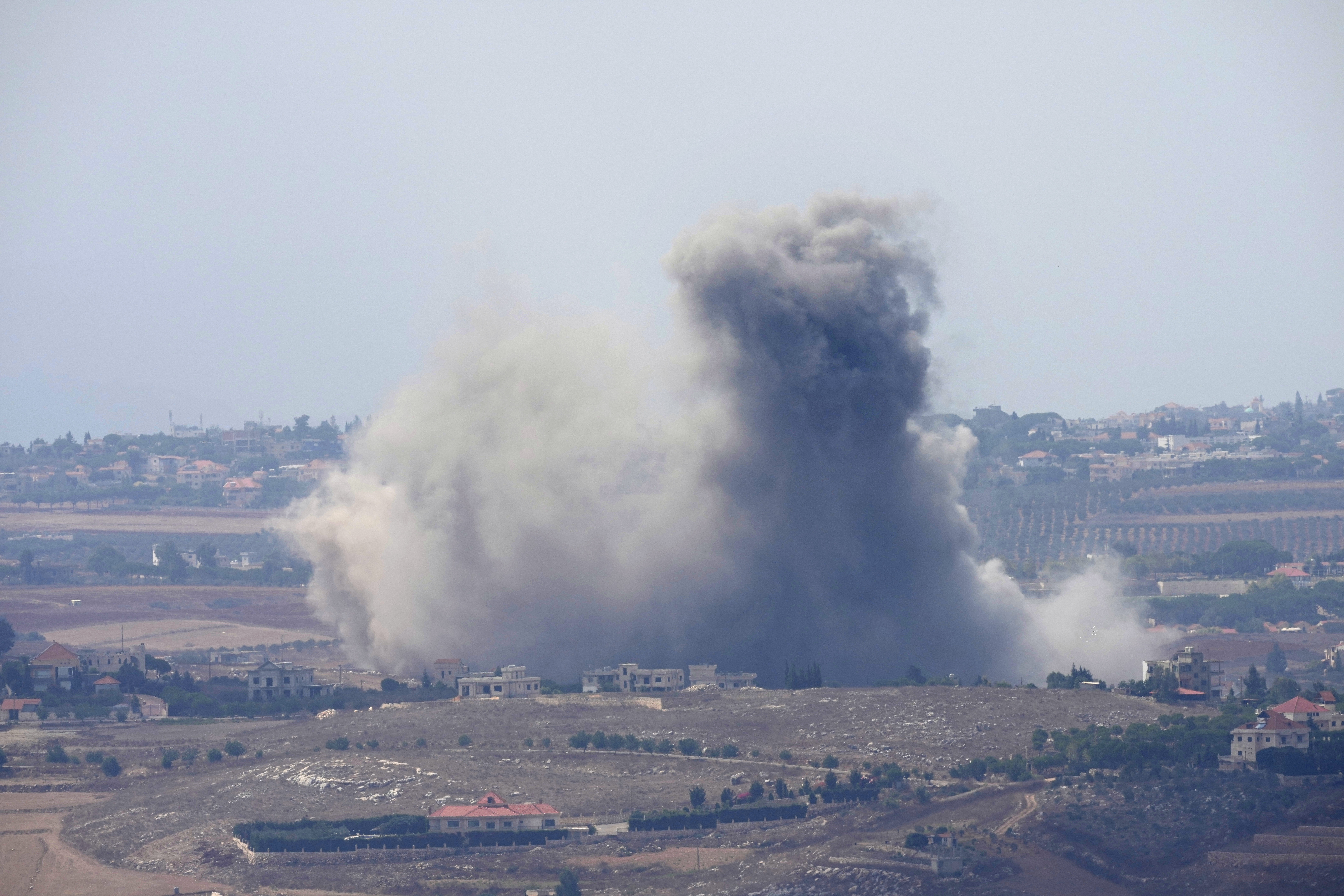 Smoke rises from Israeli airstrikes on villages in the Nabatiyeh district, seen from the southern town of Marjayoun, Lebanon, Monday, Sept. 23, 2024. (AP Photo/Hussein Malla)