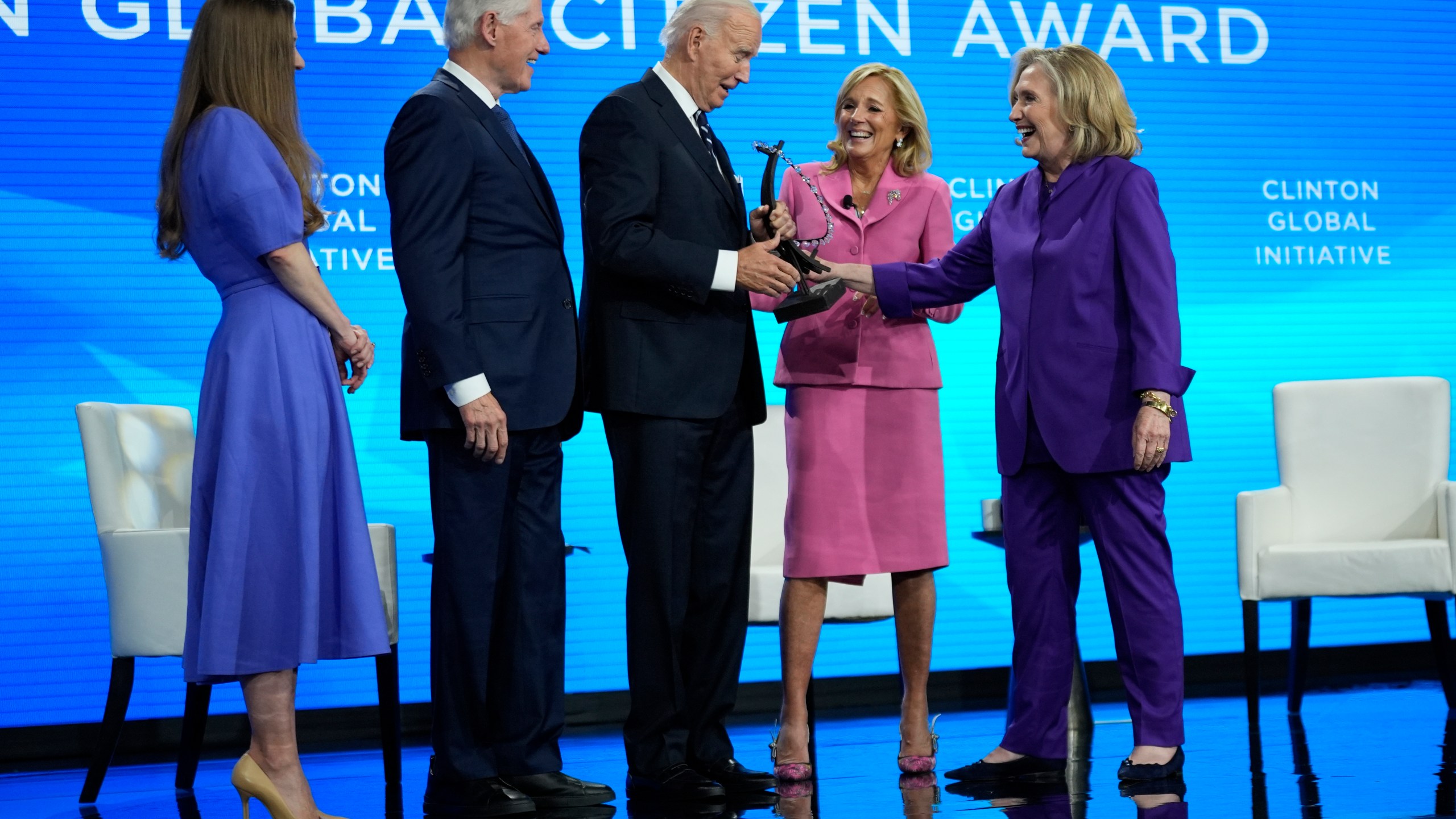 President Joe Biden is presented with the Global Citizen Award by Chelsea Clinton, former President Bill Clinton, first lady Jill Biden and former Secretary of State Hillary Clinton at the Clinton Global Initiative Monday, Sept. 23, 2024, in New York. (AP Photo/Manuel Balce Ceneta)