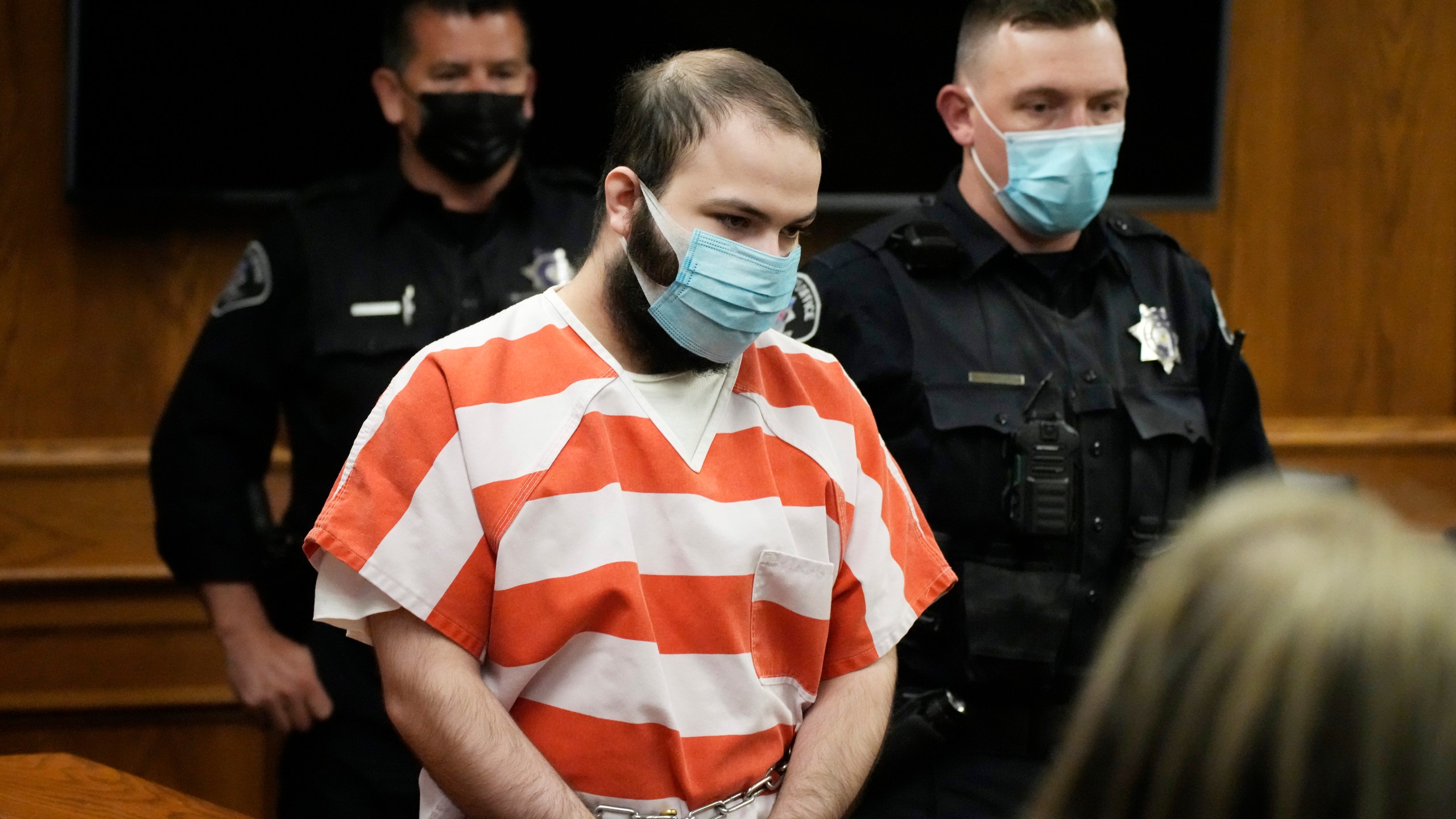 FILE - Ahmad Al Aliwi Alissa, accused of killing 10 people at a Colorado supermarket in March 2021, is led into a courtroom for a hearing, Sept. 7, 2021, in Boulder, Colo. (AP Photo/David Zalubowski, Pool, File)