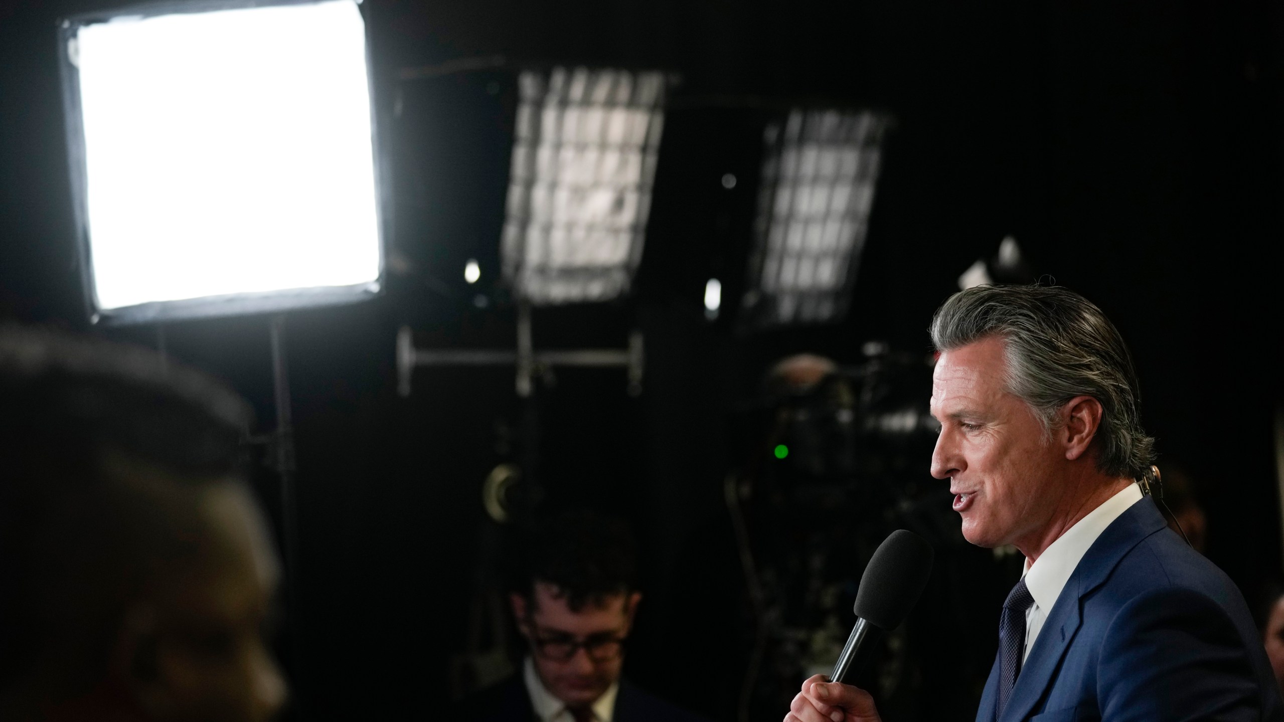 FILE - California Gov. Gavin Newsom speaks to reporters in the spin room before a presidential debate between Republican presidential nominee former President Donald Trump and Democratic presidential nominee Vice President Kamala Harris, Tuesday, Sept. 10, 2024, in Philadelphia. (AP Photo/Matt Rourke, File)