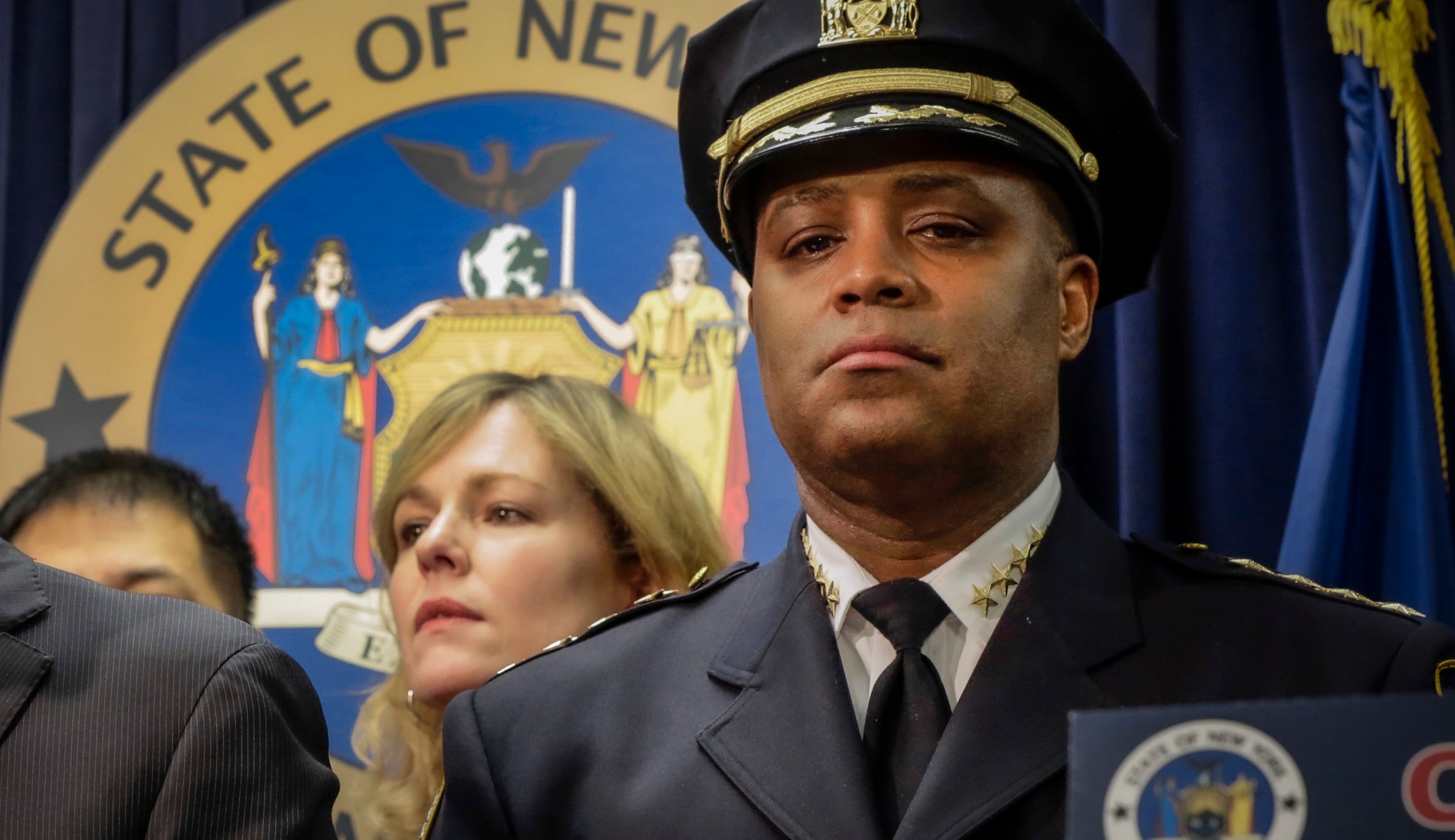 FILE - New York City Police Dept. Chief of Department Philip Banks, right, listens during a news conference in New York, on Jan. 30, 2014. (AP Photo, File)