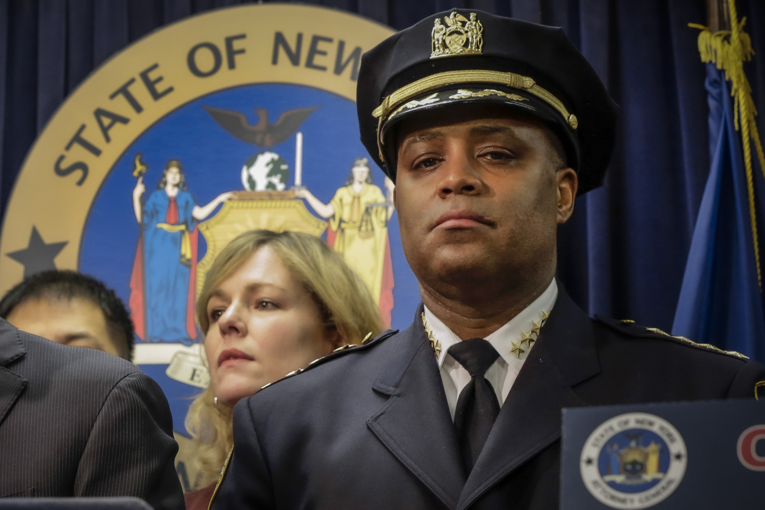 FILE - New York City Police Dept. Chief of Department Philip Banks, right, listens during a news conference in New York, on Jan. 30, 2014. (AP Photo, File)