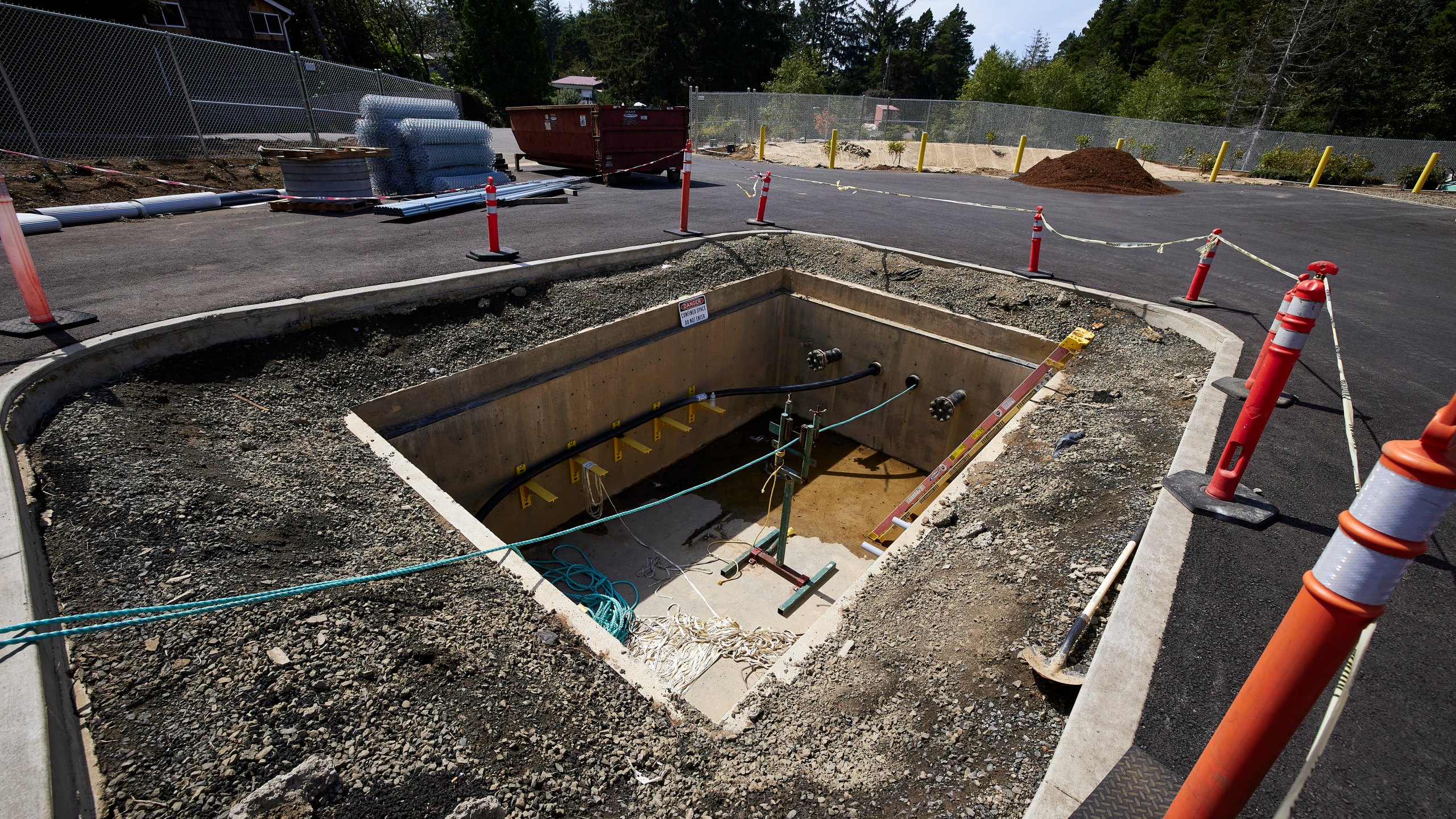 Concrete vaults under the parking lot at Driftwood State Beach where subsea cables connected to the wave energy test site arrive on land and connect to land cables in Newport, Ore., Friday, Aug. 23, 2024. (AP Photo/Craig Mitchelldyer)