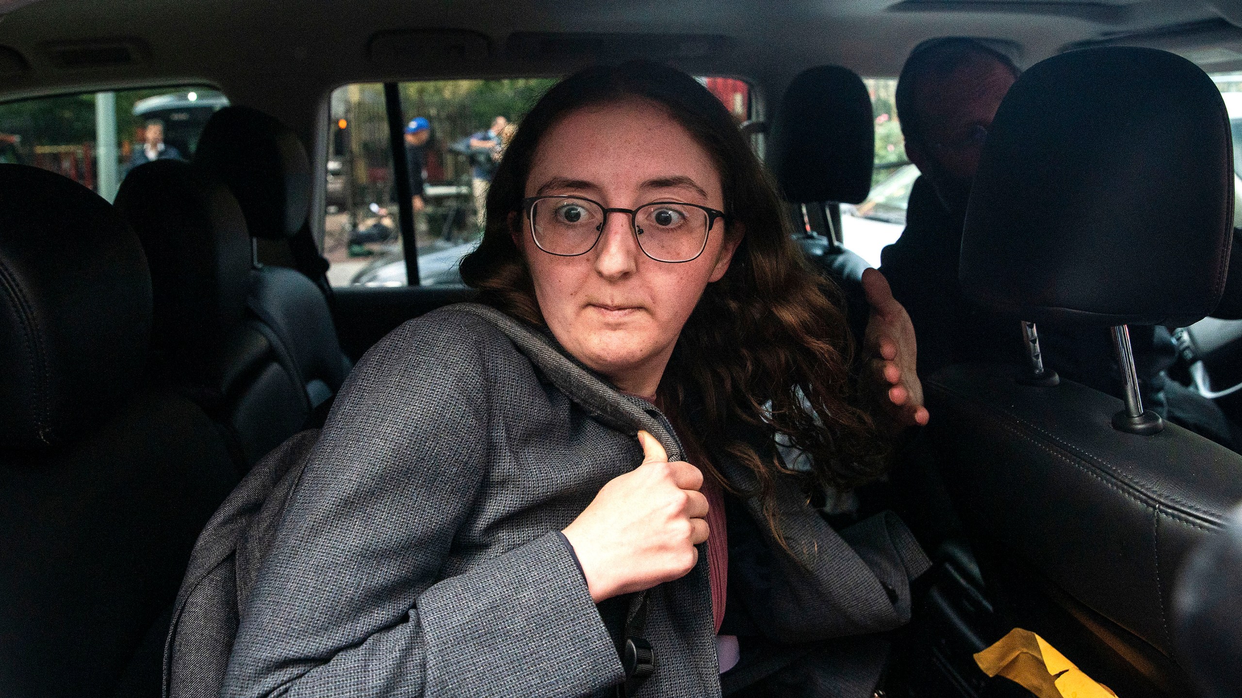 FILE - Caroline Ellison former CEO of Alameda Research founded by Sam Bankman-Fried goes into a wrong car as she exits the Manhattan federal court after testifying on Tuesday, Oct. 10, 2023, in New York. (AP Photo/Eduardo Munoz Alvarez, File)