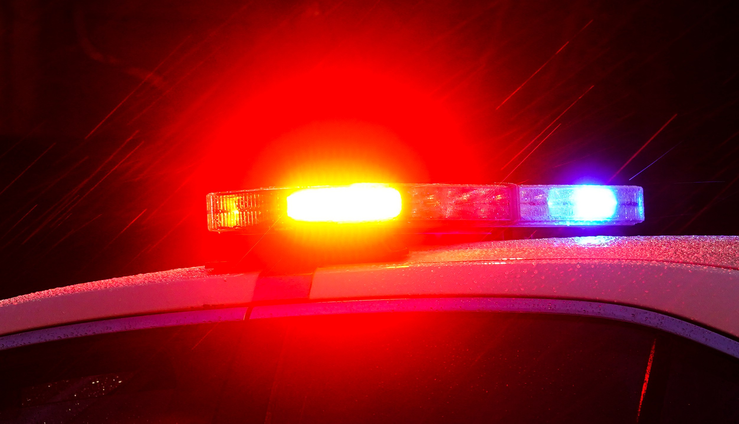 FILE - A police vehicle flashes its lights in Philadelphia, Monday, Jan. 17, 2022. (AP Photo/Matt Rourke, File)