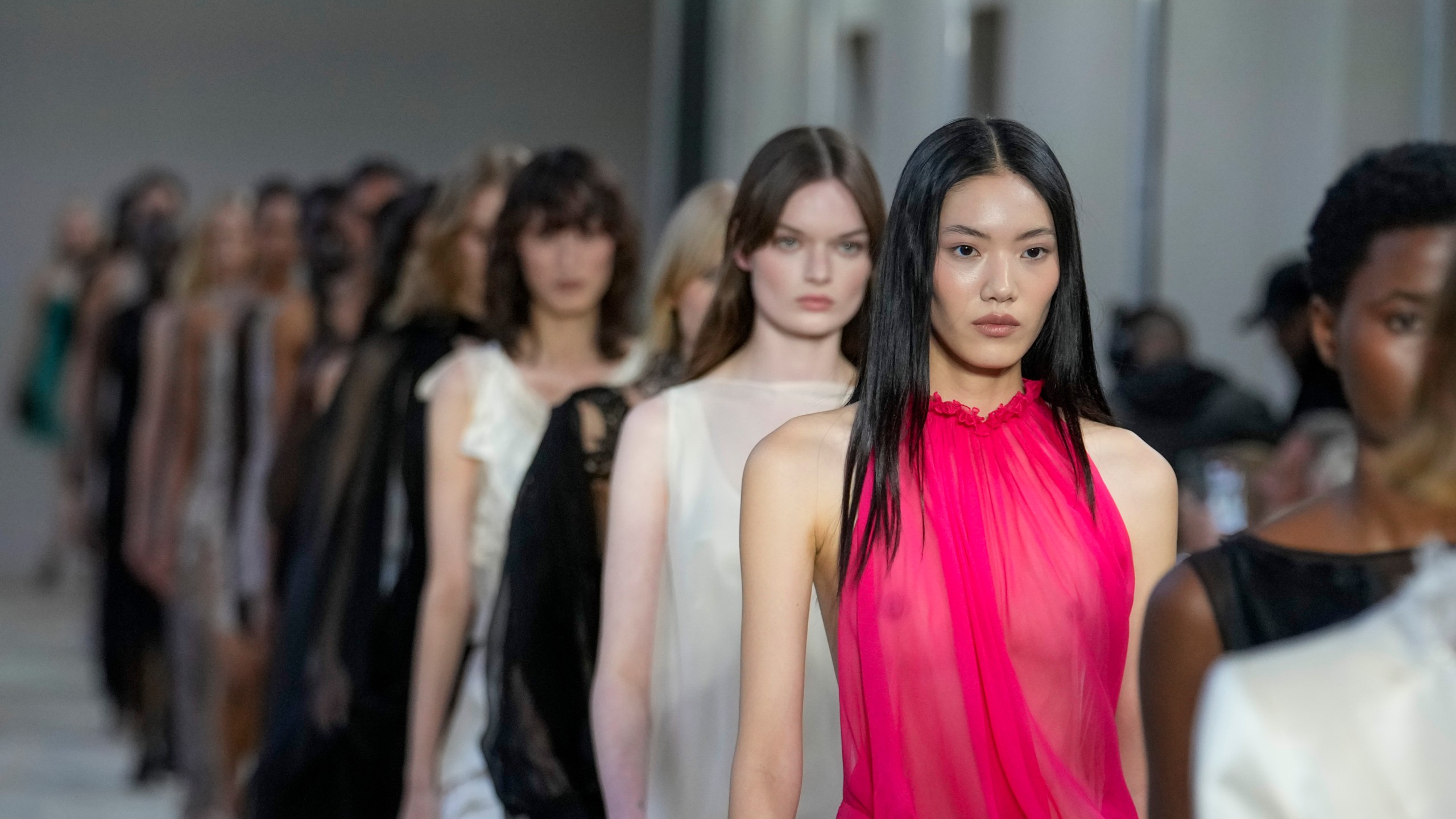 Models wear creations as part of the Alberta Ferretti Spring Summer 2025 collection, that was presented in Milan, Italy, Tuesday, Sept. 17, 2024. (AP Photo/Luca Bruno).