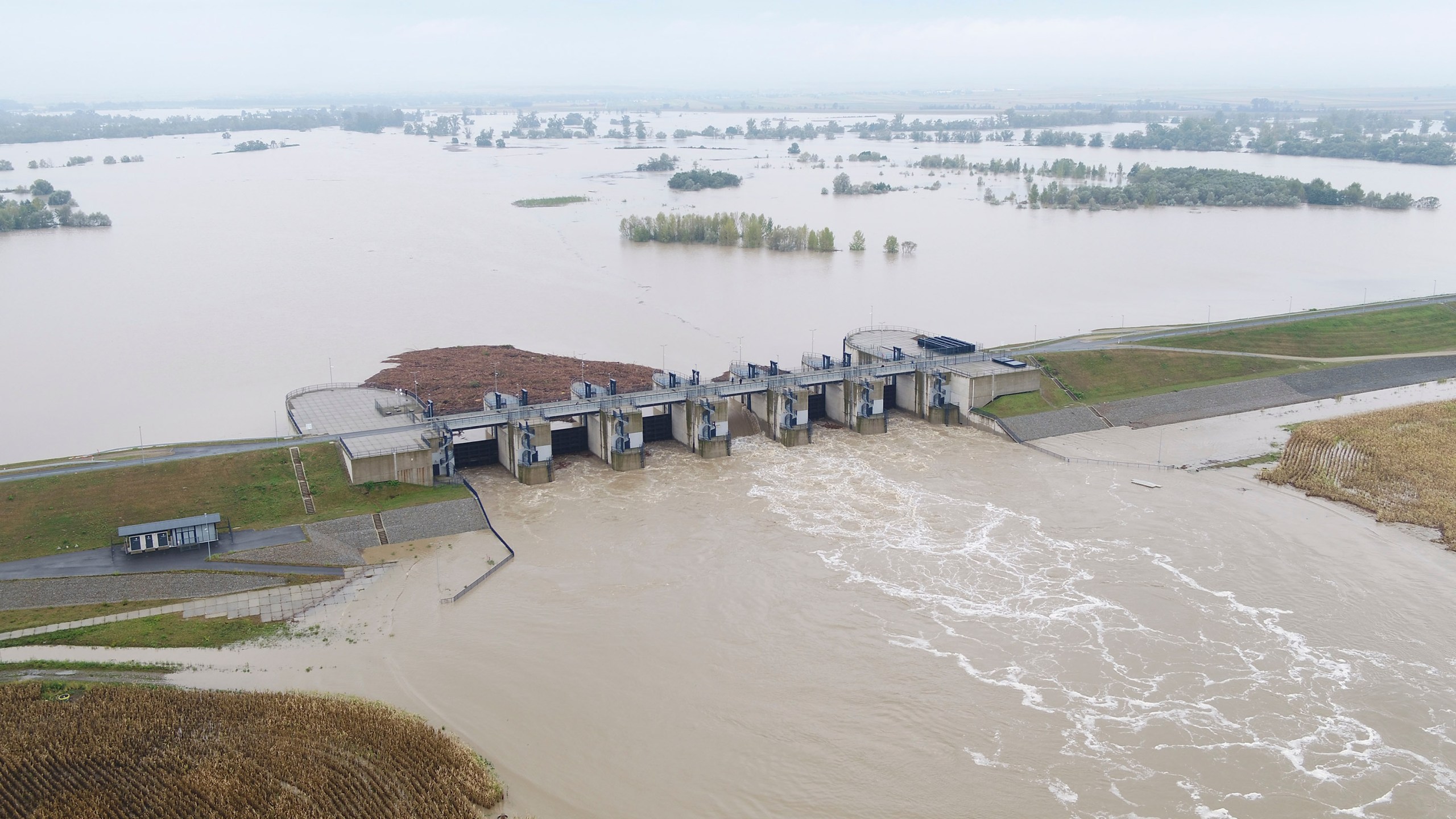 This photo provided by the state company Polish Waters shows the Oder River flood waters channelled into and contained by the newly-built Lower Raciborz Reservoir that has spared the cities of Opole and Wroclaw from flooding, in Raciborz, southwestern Poland, Sept. 16, 2024. (Polish Waters via AP)