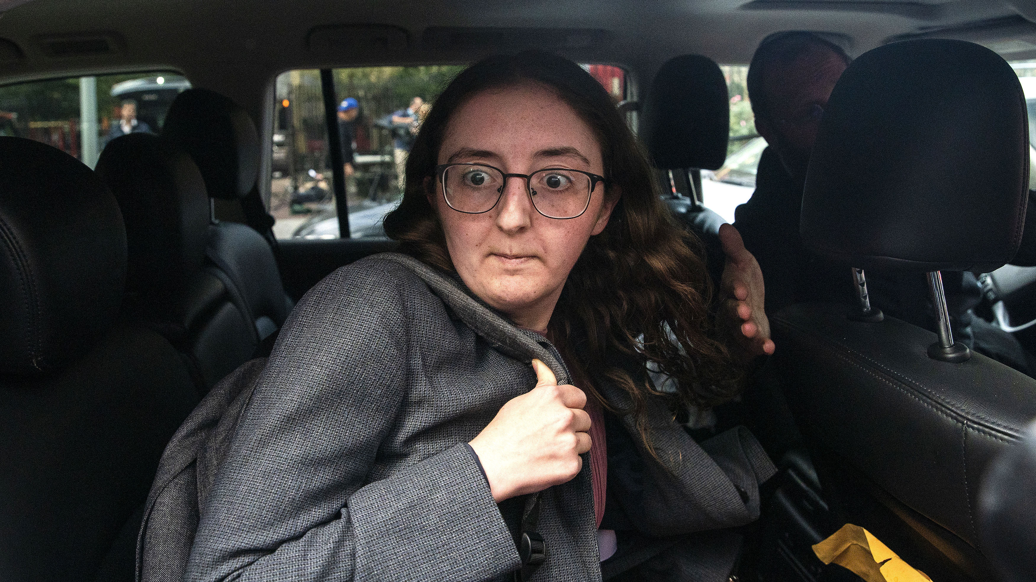 FILE - Caroline Ellison former CEO of Alameda Research founded by Sam Bankman-Fried goes into a wrong car as she exits the Manhattan federal court after testifying on Tuesday, Oct. 10, 2023, in New York. (AP Photo/Eduardo Munoz Alvarez, File)