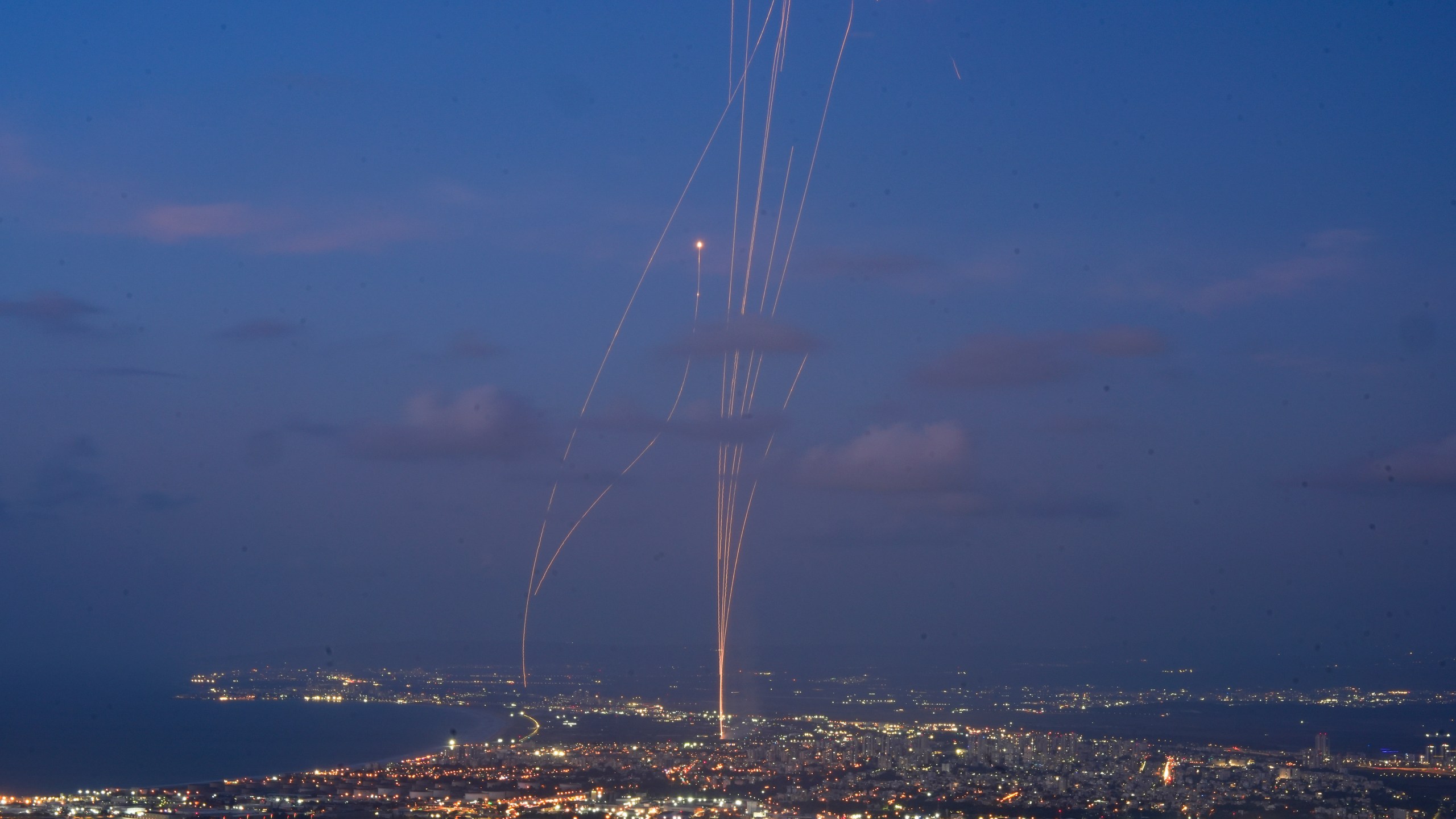 Israeli Iron Dome air defense system fires to intercept rockets that were launched from Lebanon, as seen from Haifa, northern Israel, Monday, Sept. 23, 2024. (AP Photo/Baz Ratner)