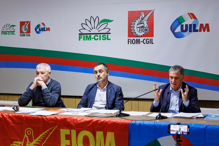 Fernando Uliano of Fim Cisl union, left, Michele De Palma of Fiom Cgil union, centre, and Rocco Palombella of Uilm union hold a news conference to announce the mobilization of Stellantis workers and the entire automotive supply chain, in Rome, Tuesday, Sept. 24, 2024. (Roberto Monaldo/LaPresse via AP)