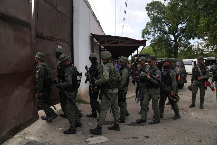 FILE - Soldiers raid the Tocorón Penitentiary Center, in Tocorón, Venezuela, Sept. 20, 2023. The Tren de Aragua gang originated at the prison. (AP Photo/Ariana Cubillos, File)