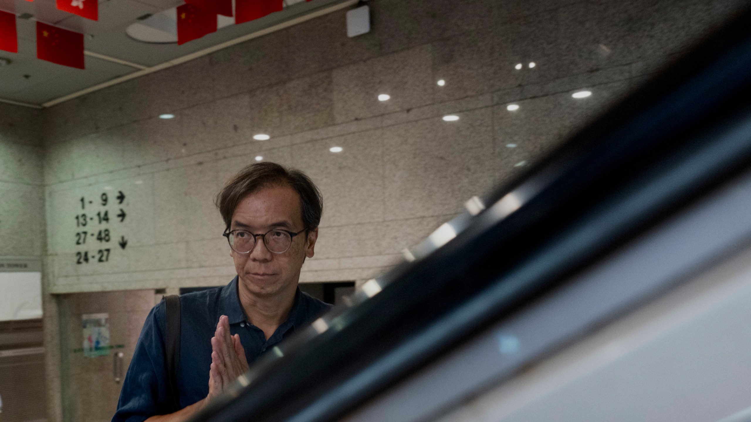 FILE - Chung Pui-kuen, the ex-chief editor of the now shuttered Stand News online outlet, outside the district court, in Hong Kong, Aug. 29, 2024. (AP Photo/Billy H.C. Kwok, File)