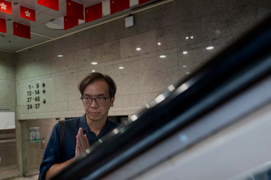 FILE - Chung Pui-kuen, the ex-chief editor of the now shuttered Stand News online outlet, outside the district court, in Hong Kong, Aug. 29, 2024. (AP Photo/Billy H.C. Kwok, File)