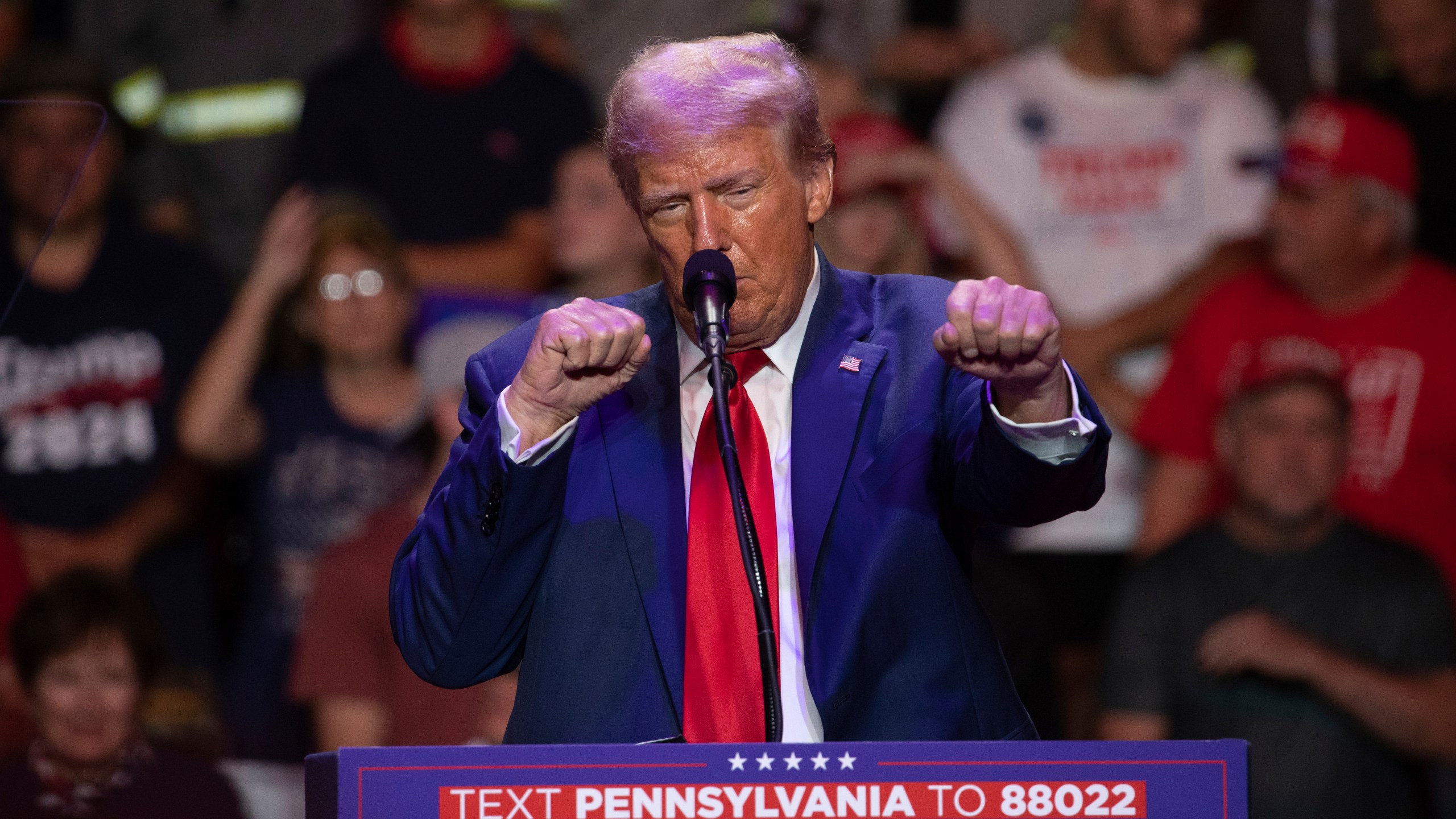 Republican presidential nominee former President Donald Trump makes a boxing gesture as he talks women's Olympic boxing during campaign rally at Ed Fry Arena in Indiana, Pa., Monday, Sept. 23, 2024. (AP Photo/Rebecca Droke)