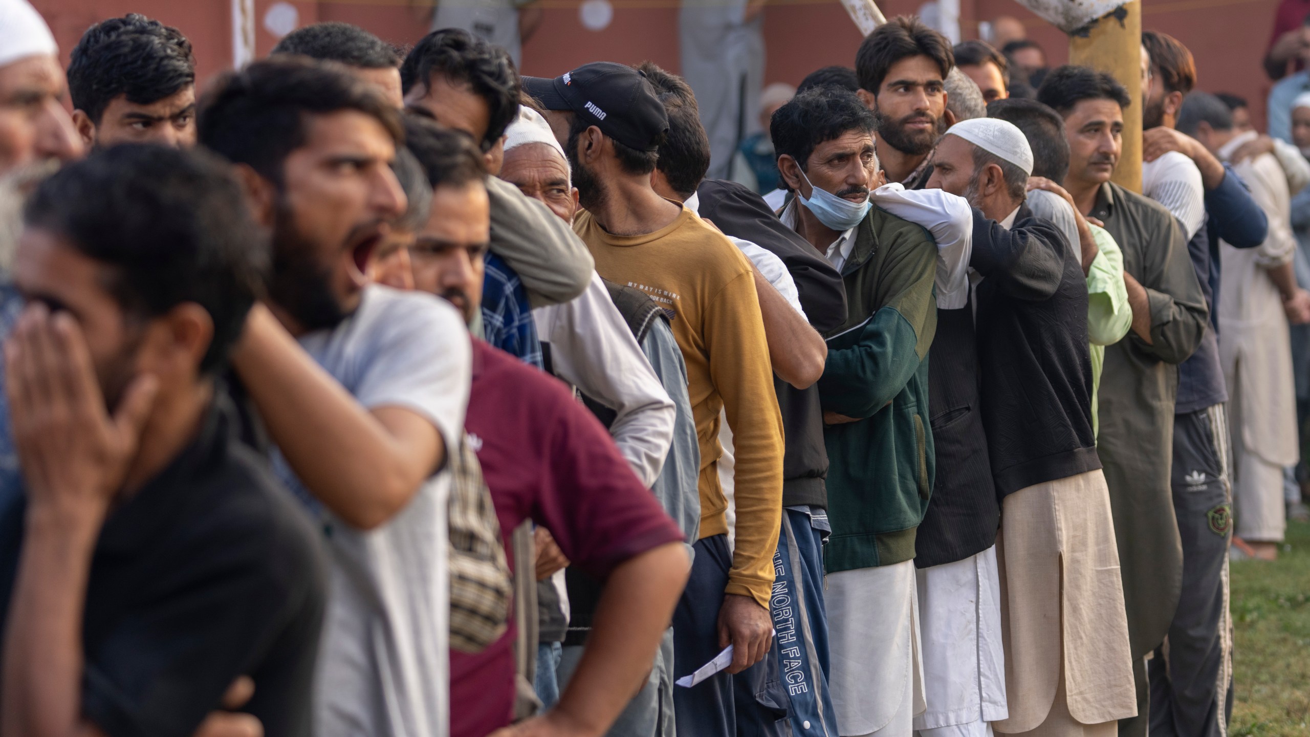 Kashmiri's queue up at a polling booth to cast their vote during the second phase of the assembly election in the outskirts of Srinagar, Indian controlled Kashmir, Wednesday, Sept. 25, 2024. (AP Photo/Dar Yasin)