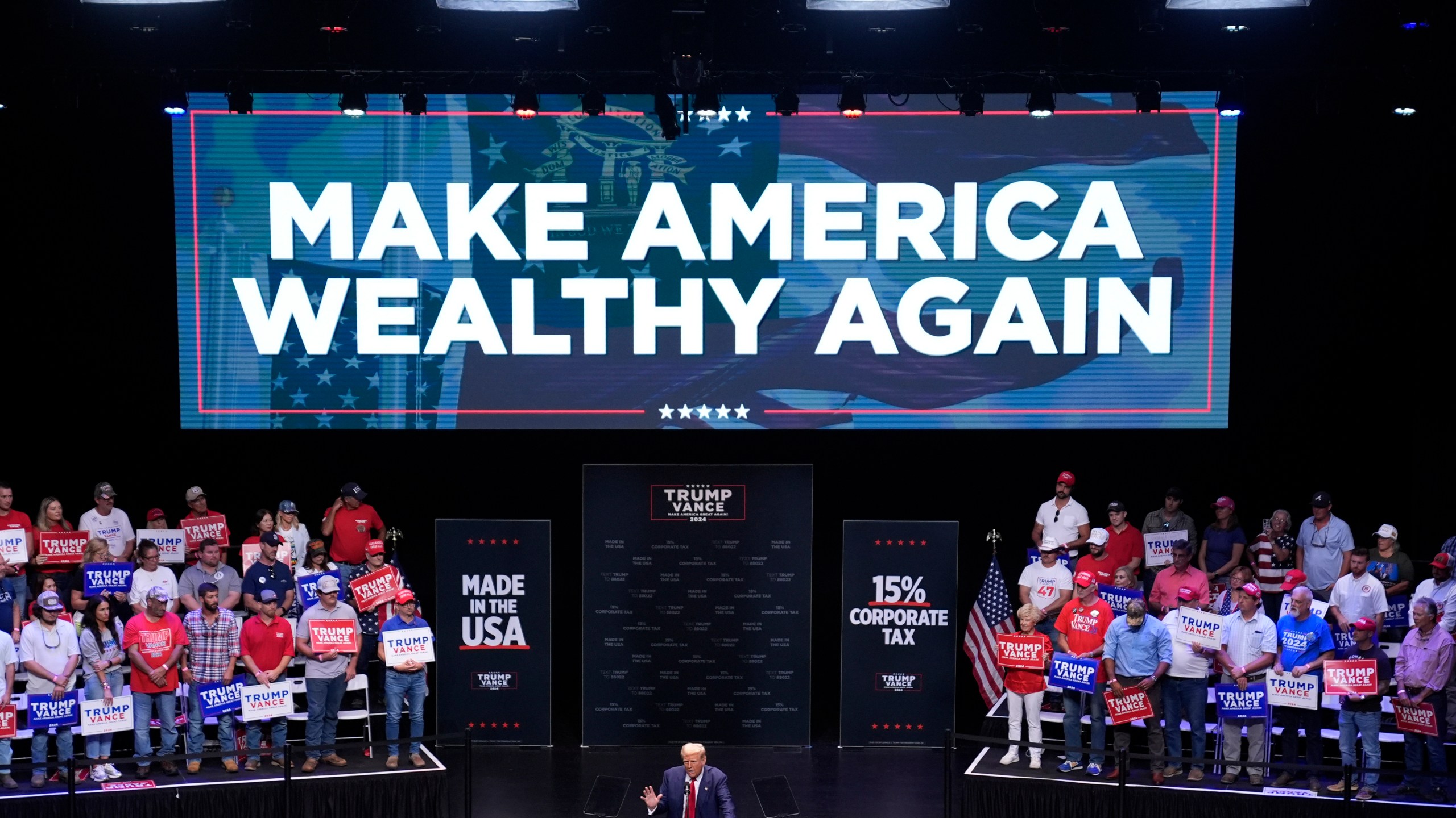 Republican presidential nominee former President Donald Trump speaks about the tax code and manufacturing at the Johnny Mercer Theatre Civic Center, Tuesday, Sept. 24, 2024, in Savannah, Ga. (AP Photo/Evan Vucci)